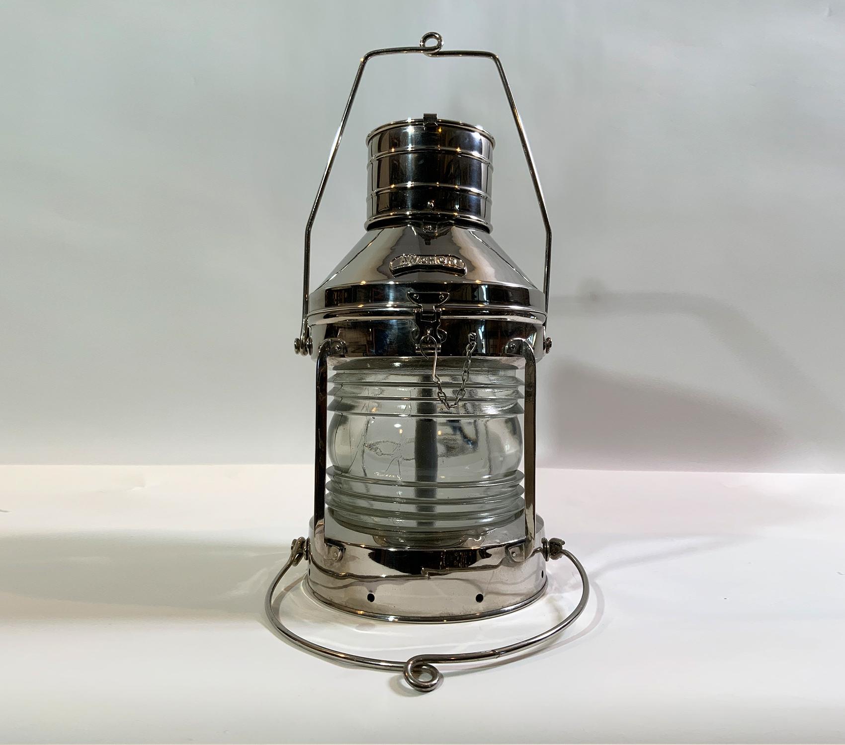 Chrome plated ships anchor lantern with glass Fresnel lens. Wired with a new socket for home use. Edison Bulb installed mirror chrome over brass finish. Spectacular lantern. Rarely found in chrome.

Weight: 12 LBS
Overall Dimensions: 18” H x 10”