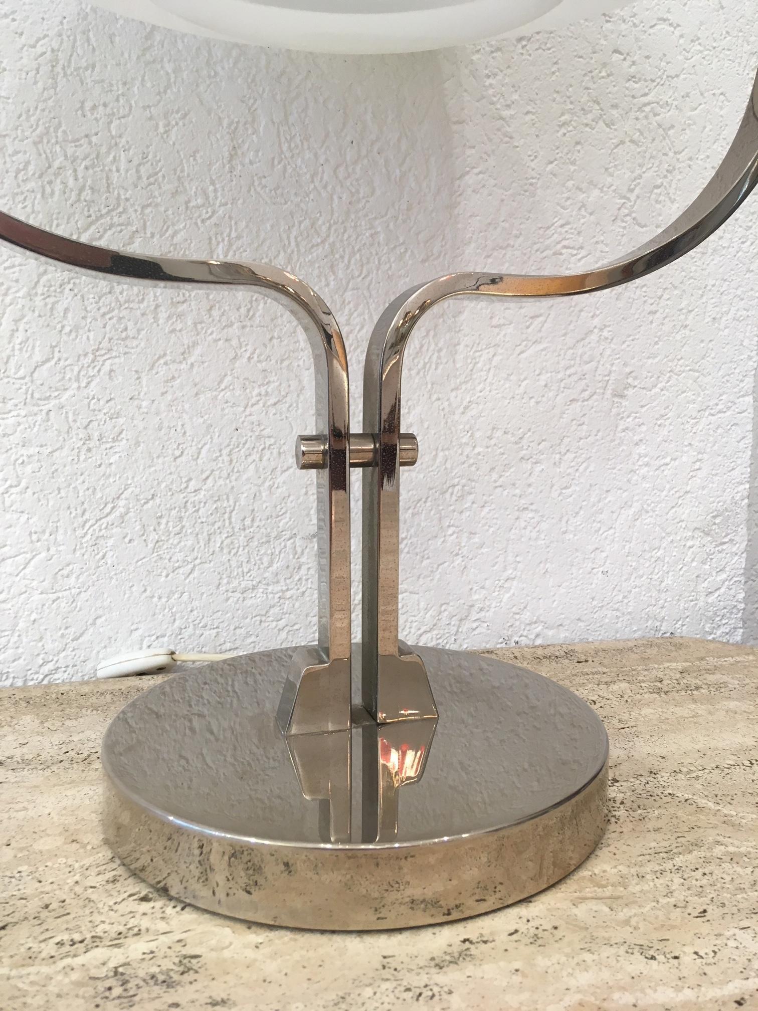 Heavy big chrome and acrylic shade table lamp, circa 1970s.
Around 5-6 kgs
Probably made in Switzerland.
 