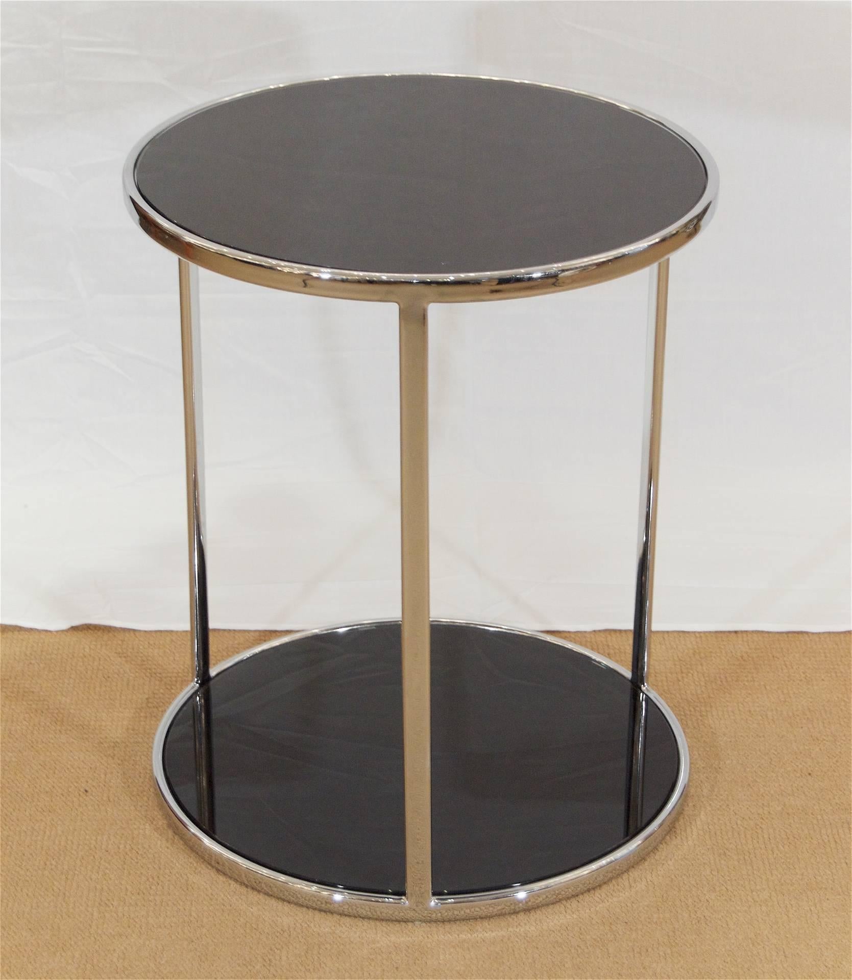 Well-sized side or cocktail table in chromed steel with black back-painted glass inserts; excellent finish quality.