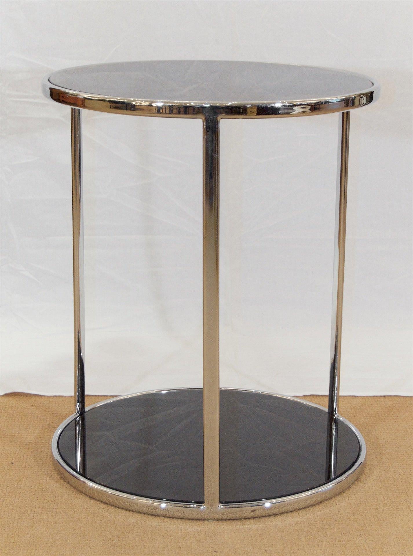 Well-sized side or cocktail table in chromed steel with black back-painted glass inserts; excellent finish quality.