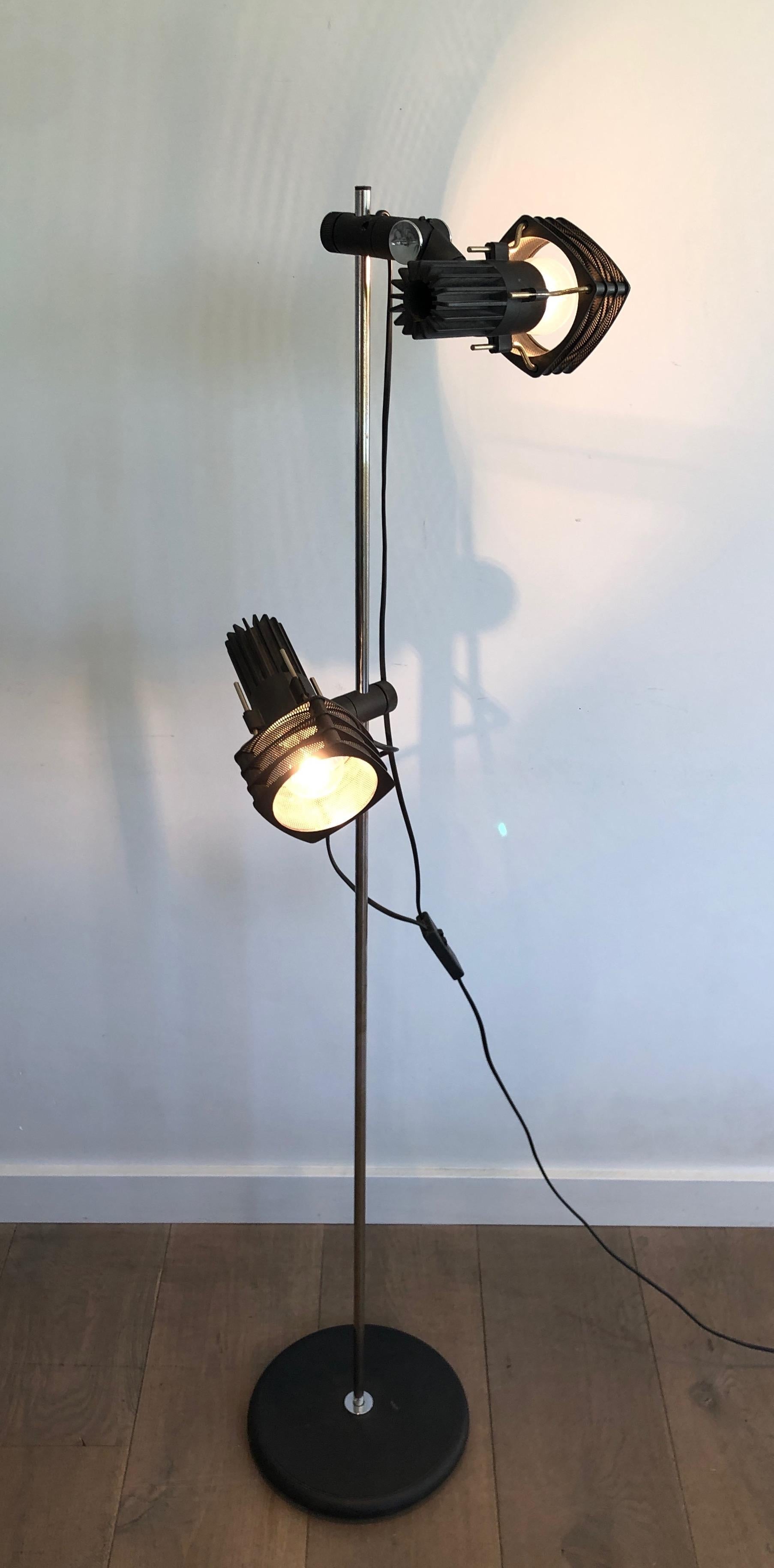 This design floor lamp with adjustable lights is made of chrome and black lacquer. This is a French work, circa 1980.