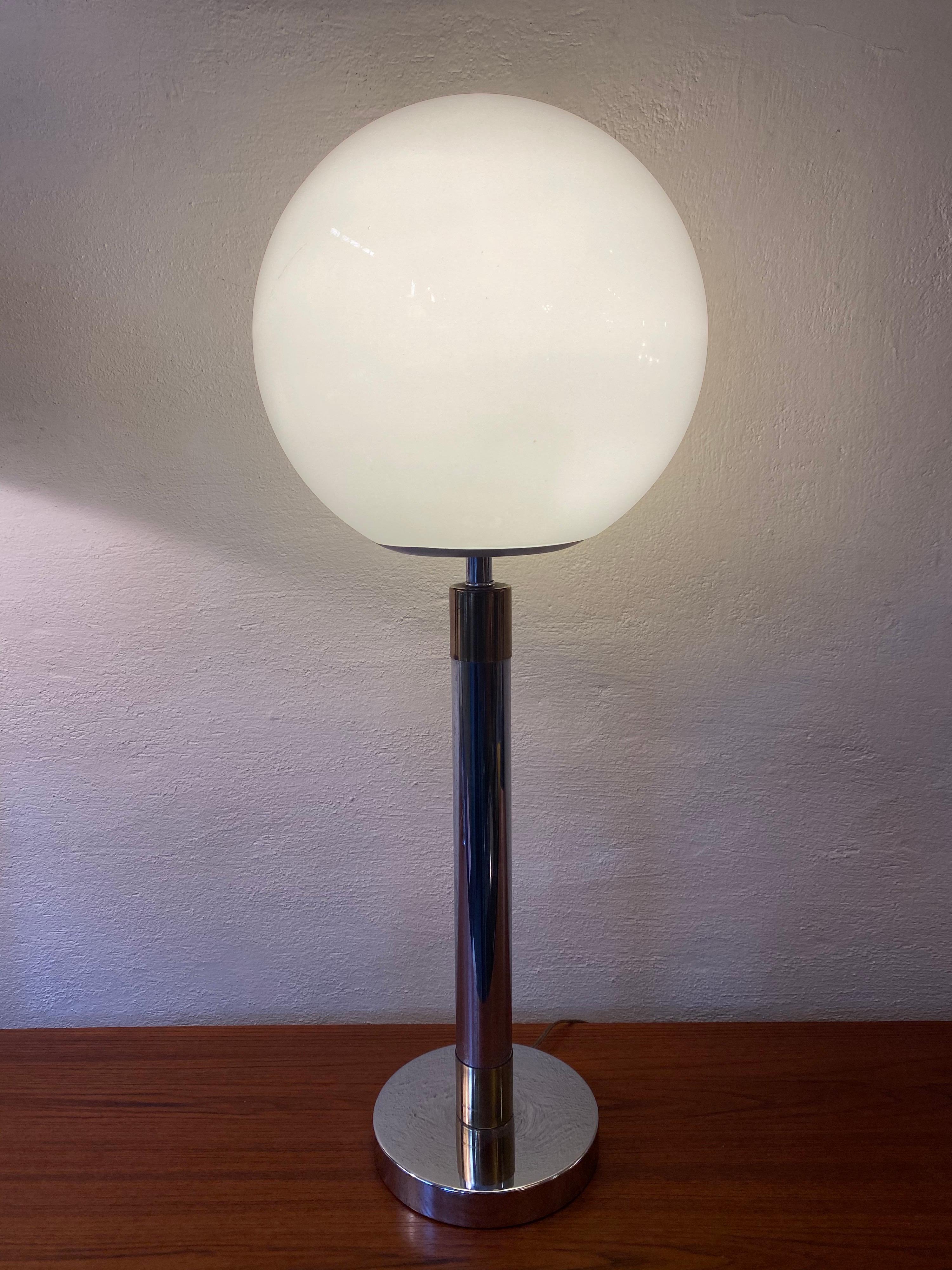 Chrome and brass table lamp, nice scale and size! Glass frosted shade sits securely on the metal platform, held in place with a set screw. On/off switch bottom of globe.