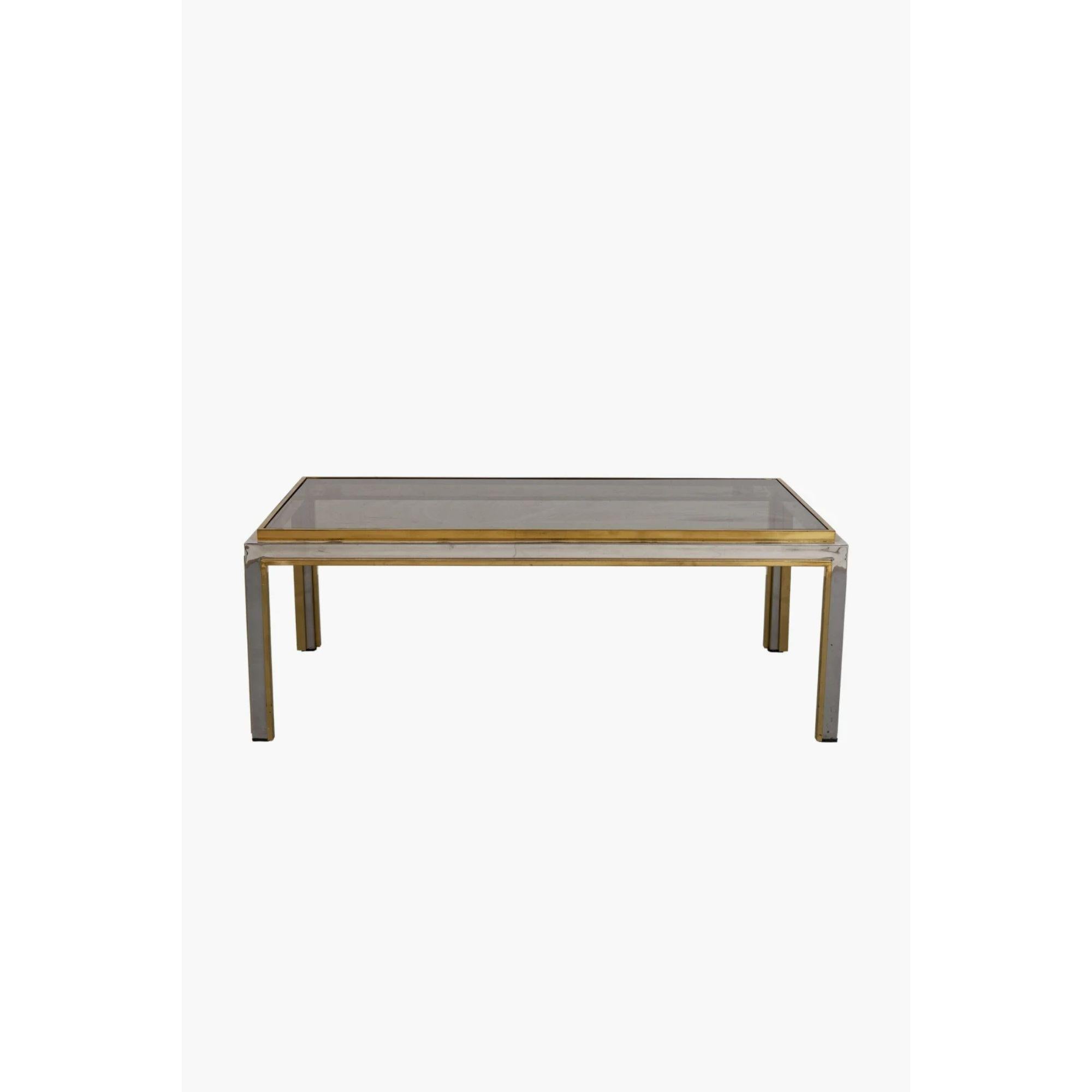 Chrome and brass coffee table by Romeo Rega, 1970s

1970s Italian brass and chrome coffee table with smoked glass top by Romeo Rega.

Dimensions: 41 x 110 x 60 cm
Condition: Minor scuffs and scratches to the polished finish commensurate with