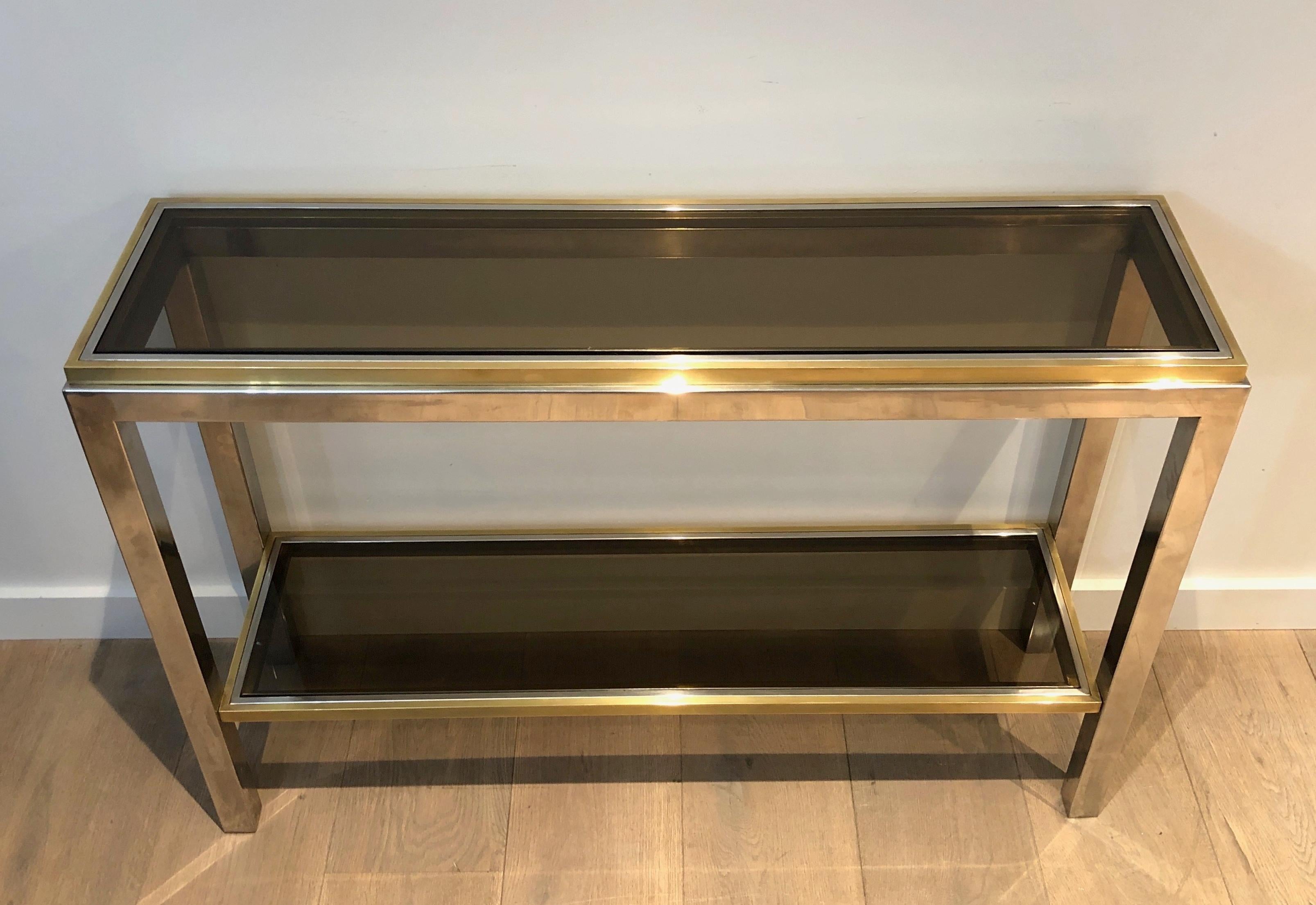 This beautiful Console table is made of Brass and Chrome. This is a French work attributed to Willy Rizzo. Circa 1970.
 