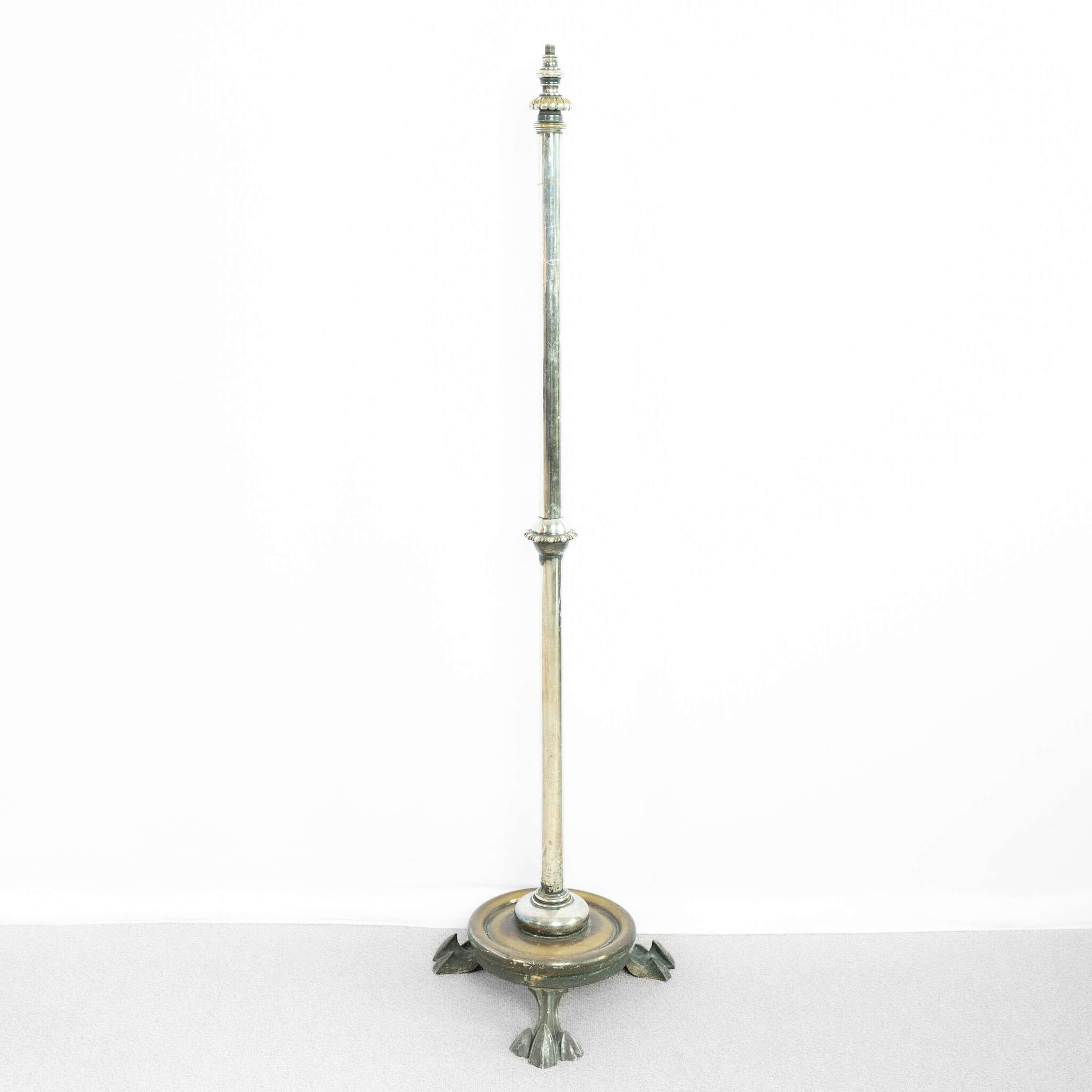 Chrome and Brass Floor Lamp.
With lion paw foot base and deco styling.
Sold wired and pat tested.

France, circa 1930.

Height: 148cm
Width: 33cm
Depth: 30.5cm
Please message if any further info or photos are required 
SHIPPING
The quotes shown are