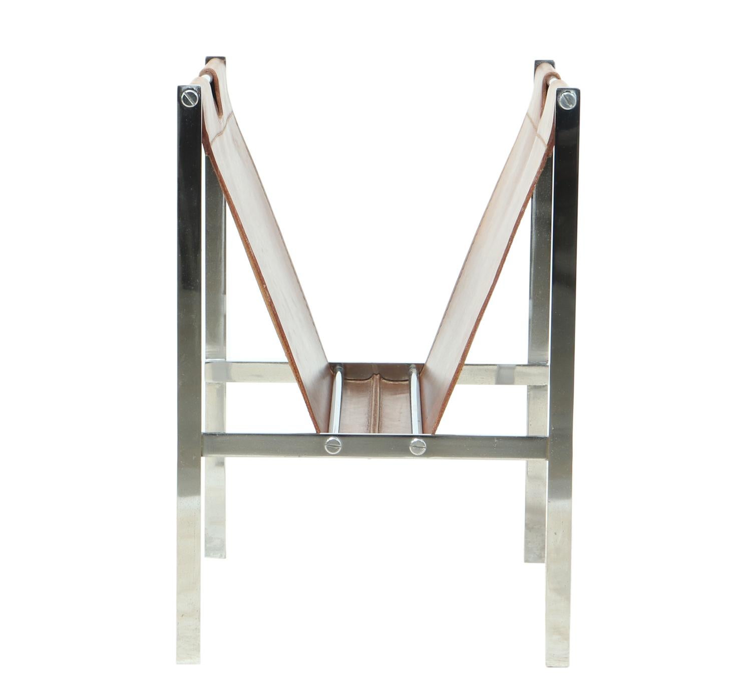 Chrome and coach leather magazine rack, circa 1960
A very good quality chromed steel and stitched coach leather magazine or book rack in very good condition with minimal wear

Age: 1960

Style: Mid-Century Modern

Material: Chromed steel and