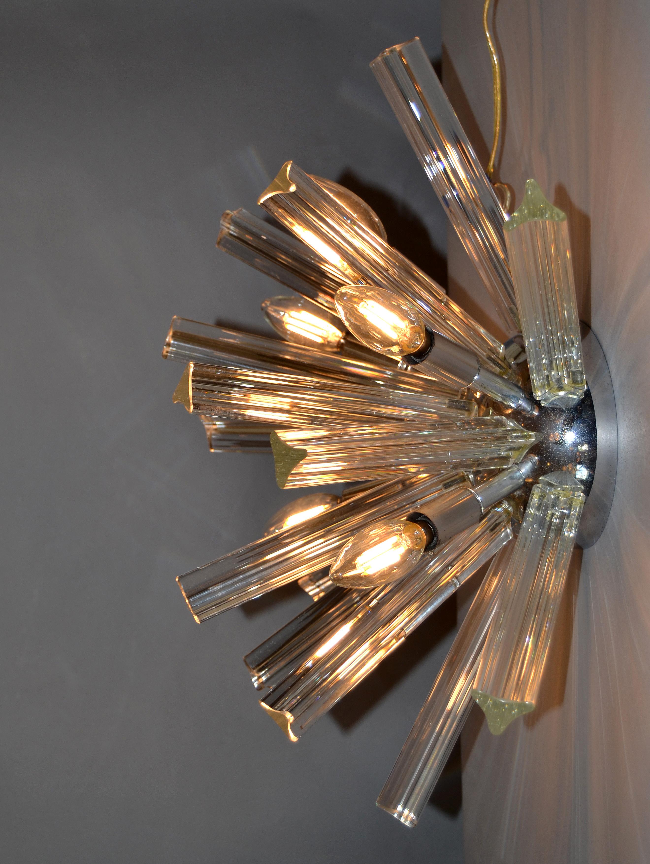 Mid-Century Modern chrome and crystal Sputnik light fixture.
Can be used as a ceiling light as well as a wall light fixture.
In perfect working condition and uses 6 max. 40 watts light bulbs, we are using LED lights.