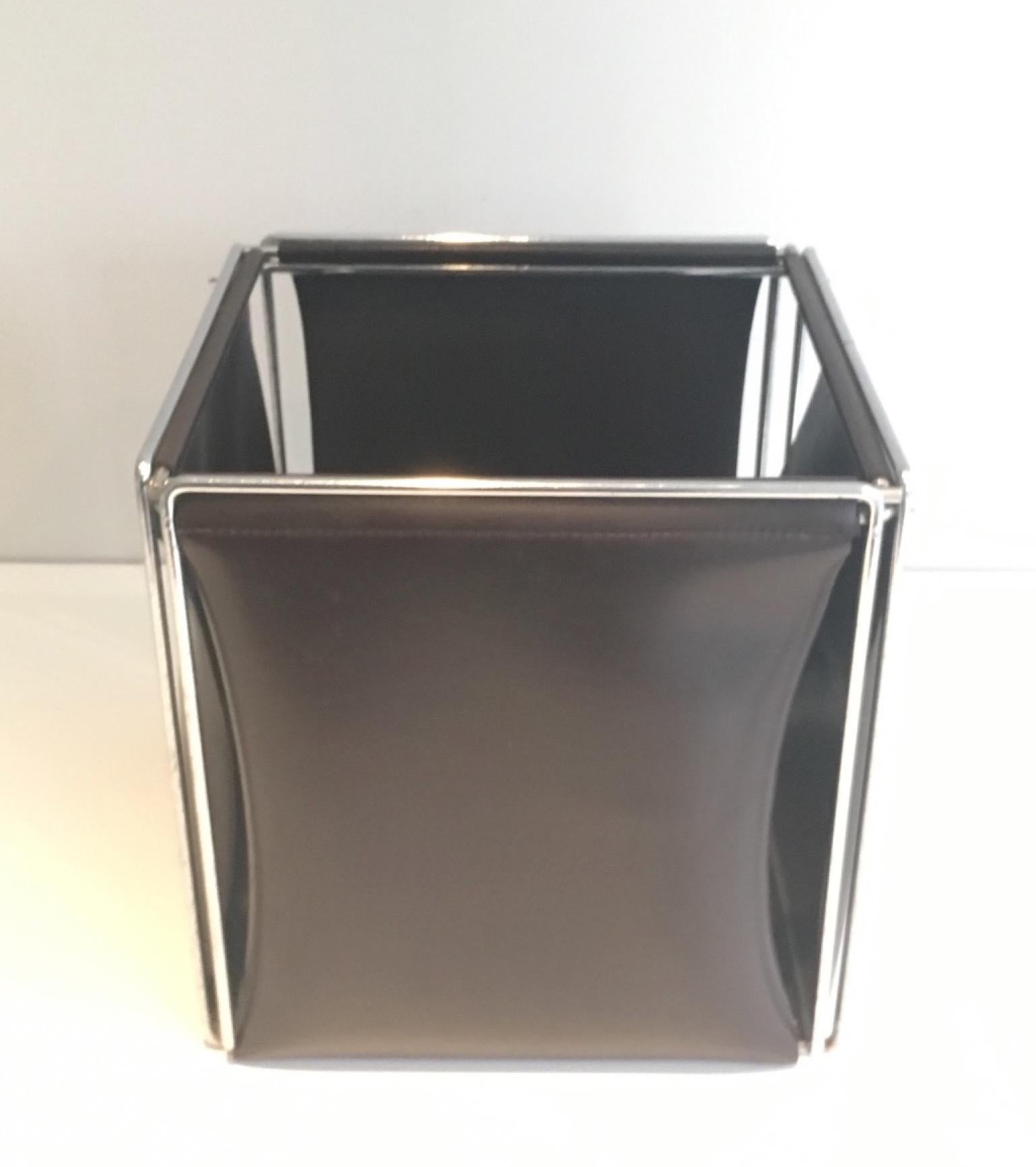 This waste paper basket is made of chrome and faux-leather. This is a French work. Circa 1970.