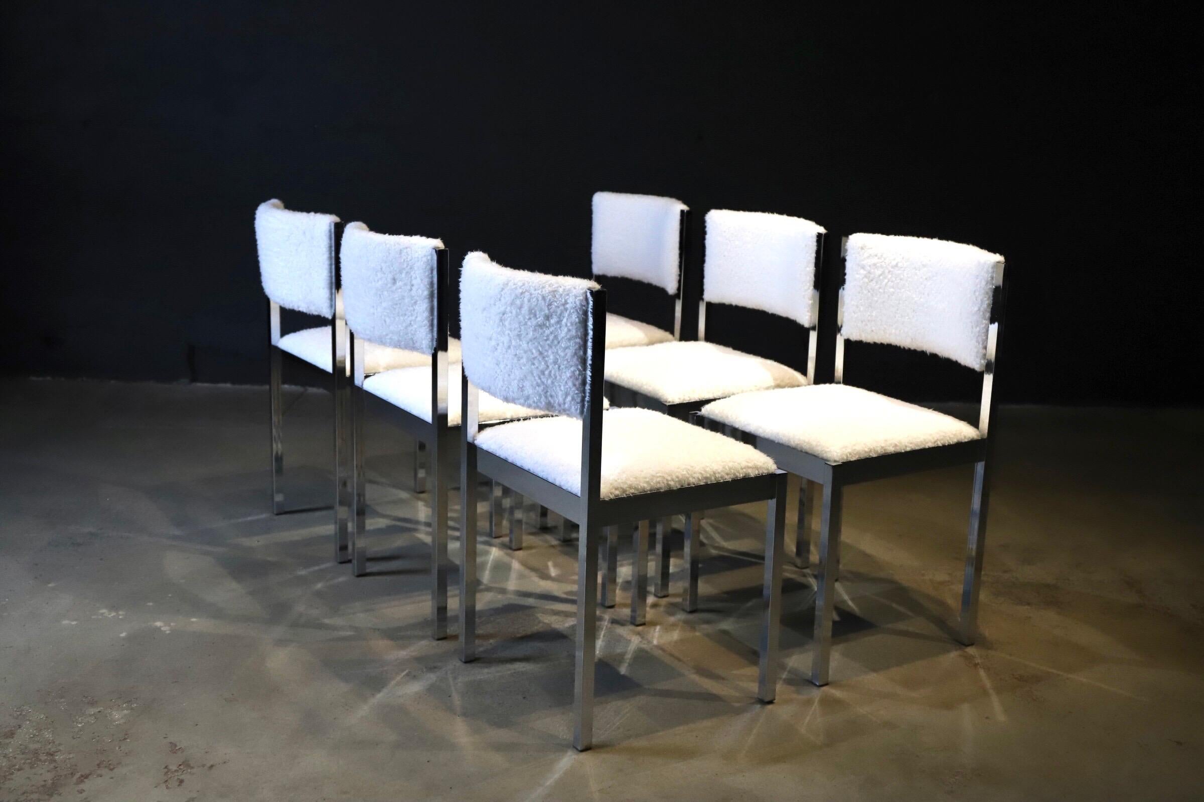 Set of six (6) chrome dining chairs by Daystrom with fresh, new faux sheepskin upholstery. A fluffy curved back and seat makes these chairs incredibly comfortable. Sure to make a statement in any dining room. Pictured with spider leg wood and glass