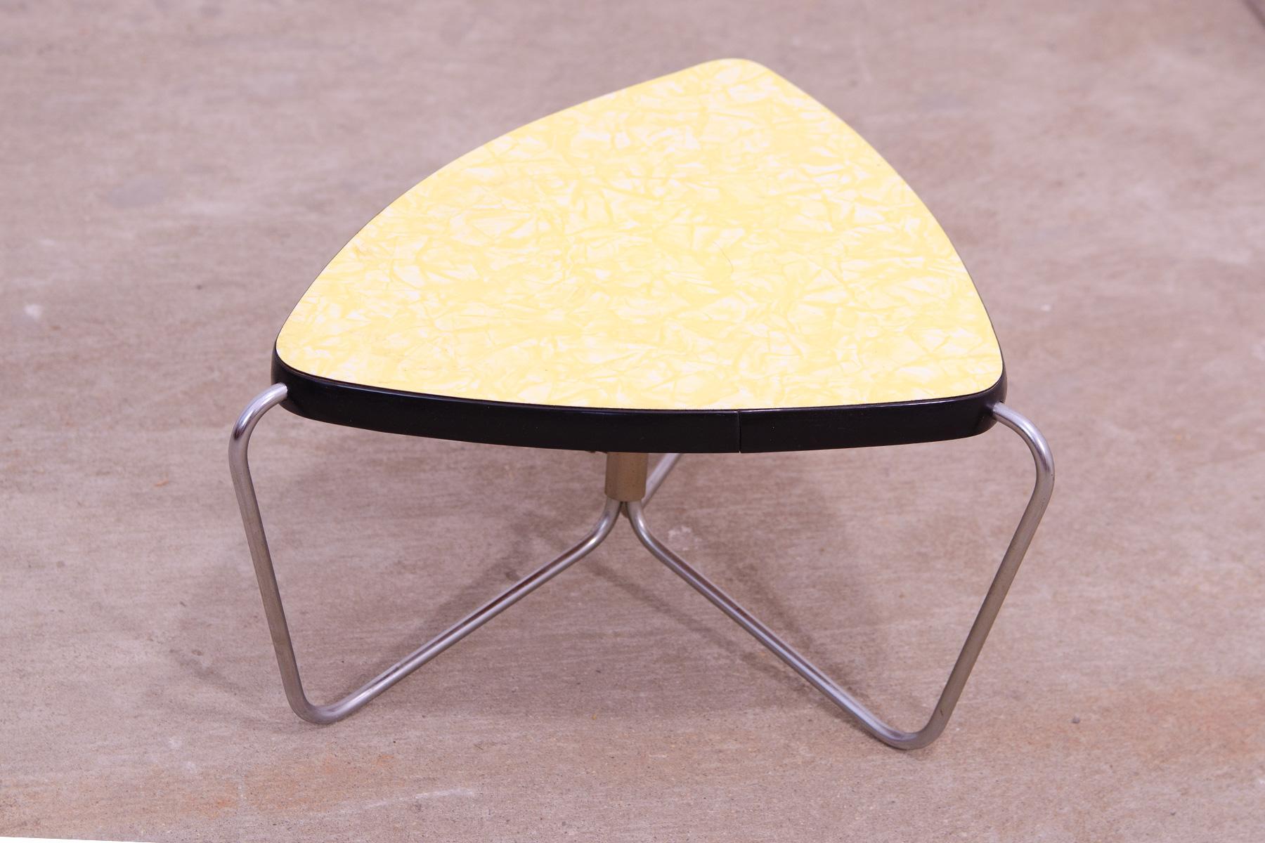 Mid-century Bauhaus style flower stand. It was made by Kovona company in the 1960´s. It has a chromium plated structure and a formica top.
This functional and flexible stool reflects the modernist spirit of the 50’s. Overall in good Vintage