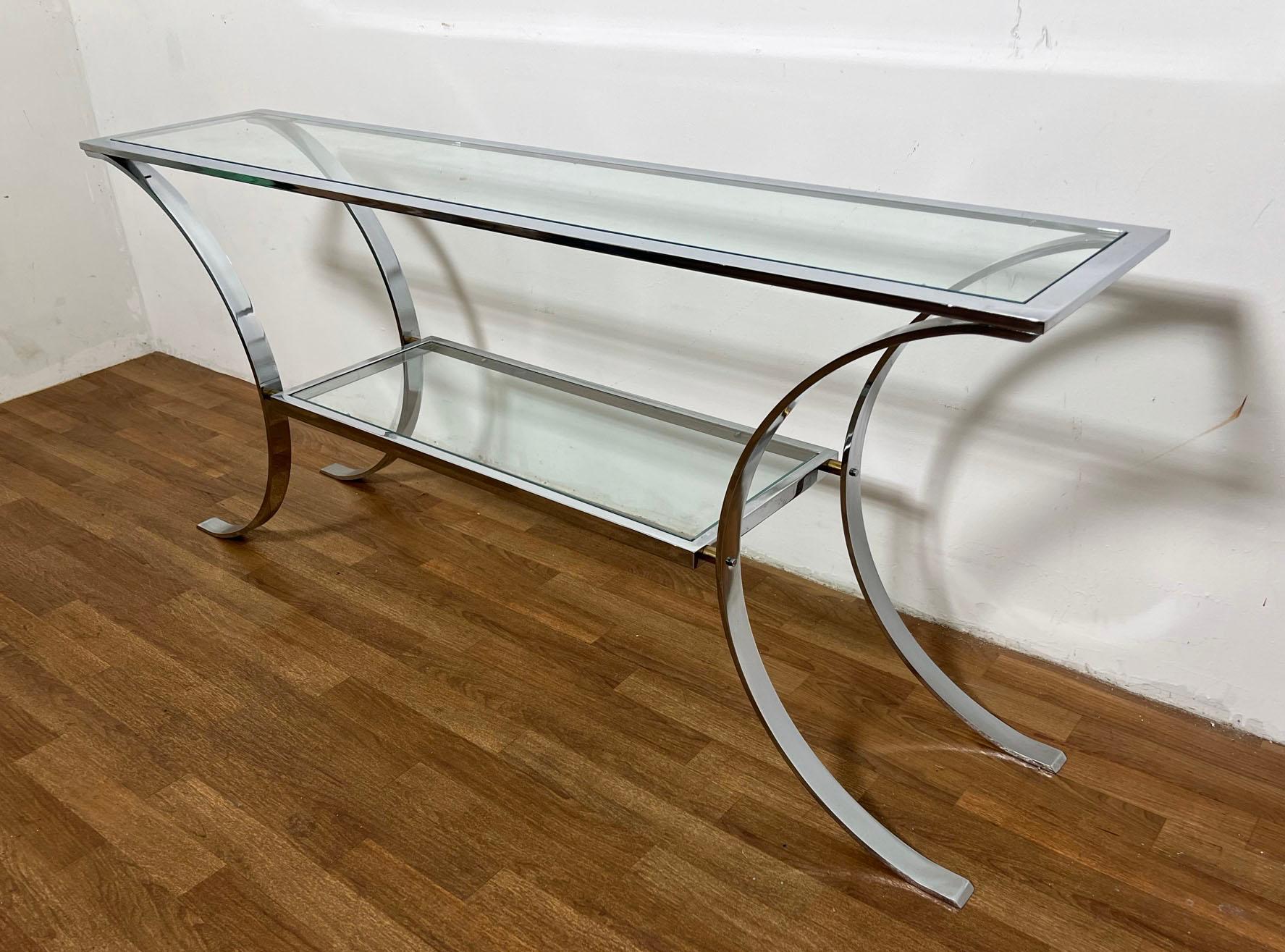 A chrome and glass arched console table, ca. 1970s, in the style of Milo Baughman. Most likely of High Point, NC origin.