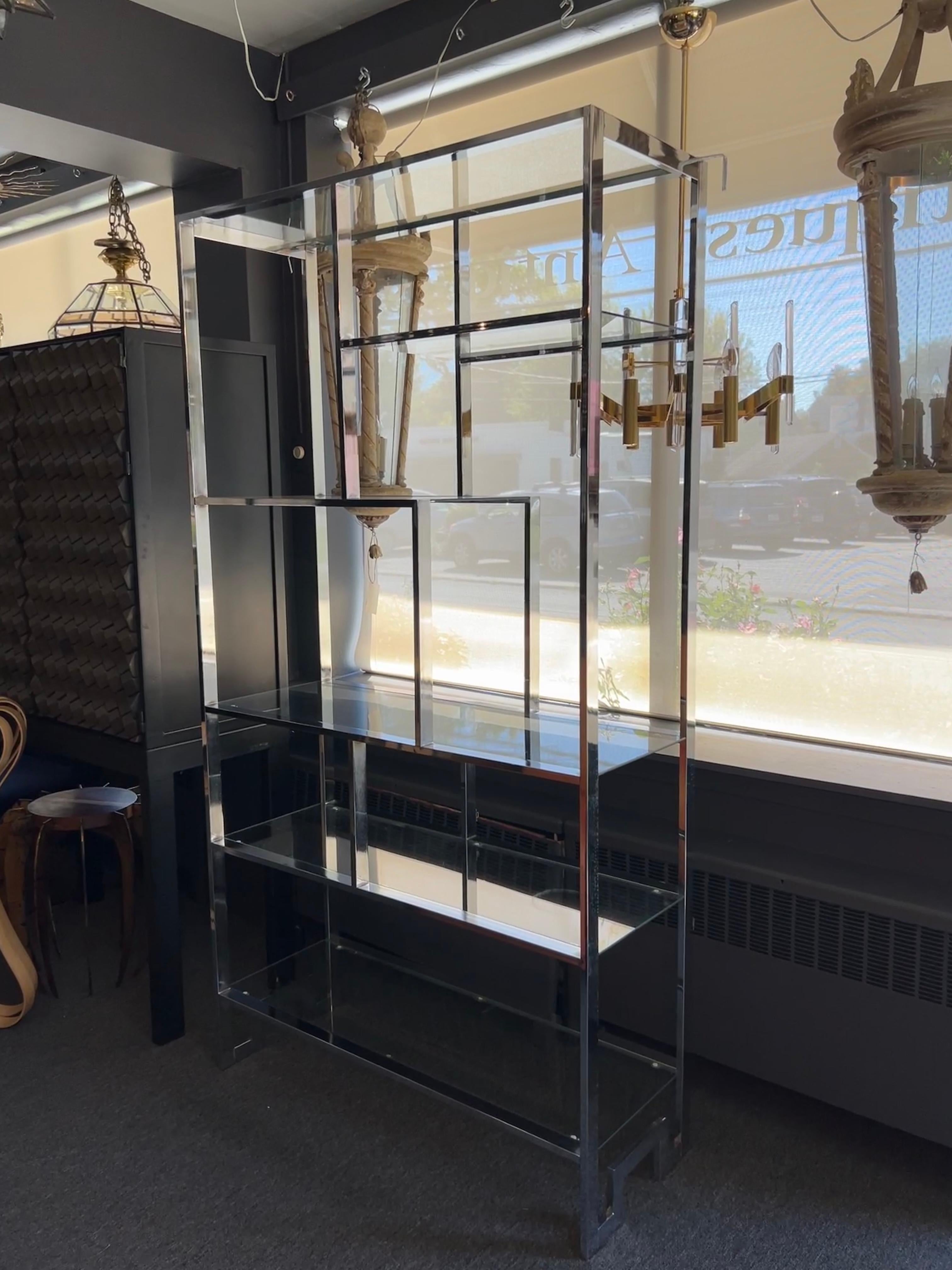 Chromed steel geometric etageres,  with six glass shelves