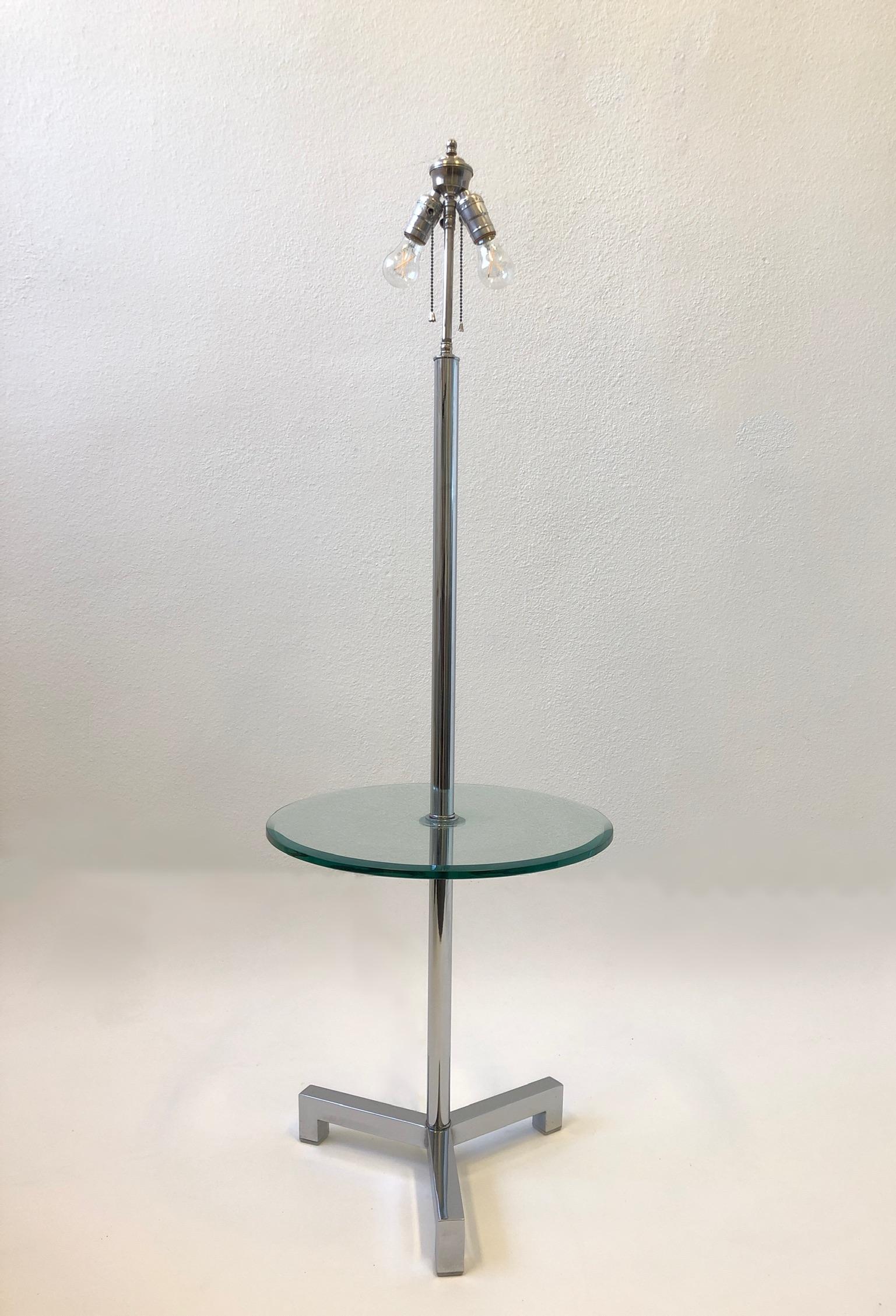 Glamorous polish chrome and beveled glass floor lamp table by Charles Hollis Jones.
According to CHJ he designed this for Arthur Elrod in the 1960’s.
Newly rewired and new vanilla linen shade.
Dimensions: 18” diameter, 52.5” high and 19.5” high