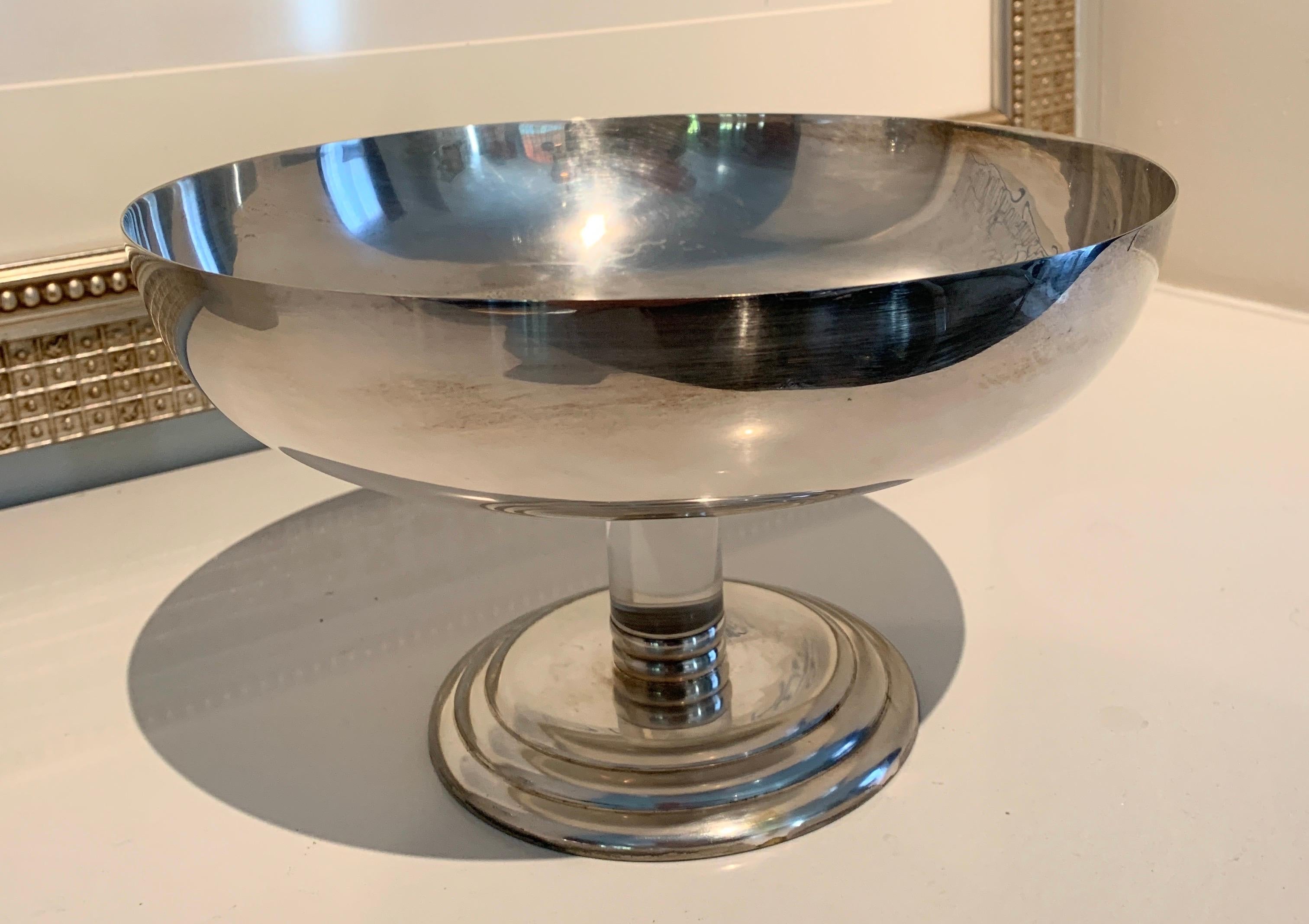 Mid-Century Modern Chrome with a glass rod footed bowl. A compliment to any table as a center piece, at the door as a catch all, or to show flowers / fruit. The bowl is simple, elegant and translates easily from it's mid century heritage to todays