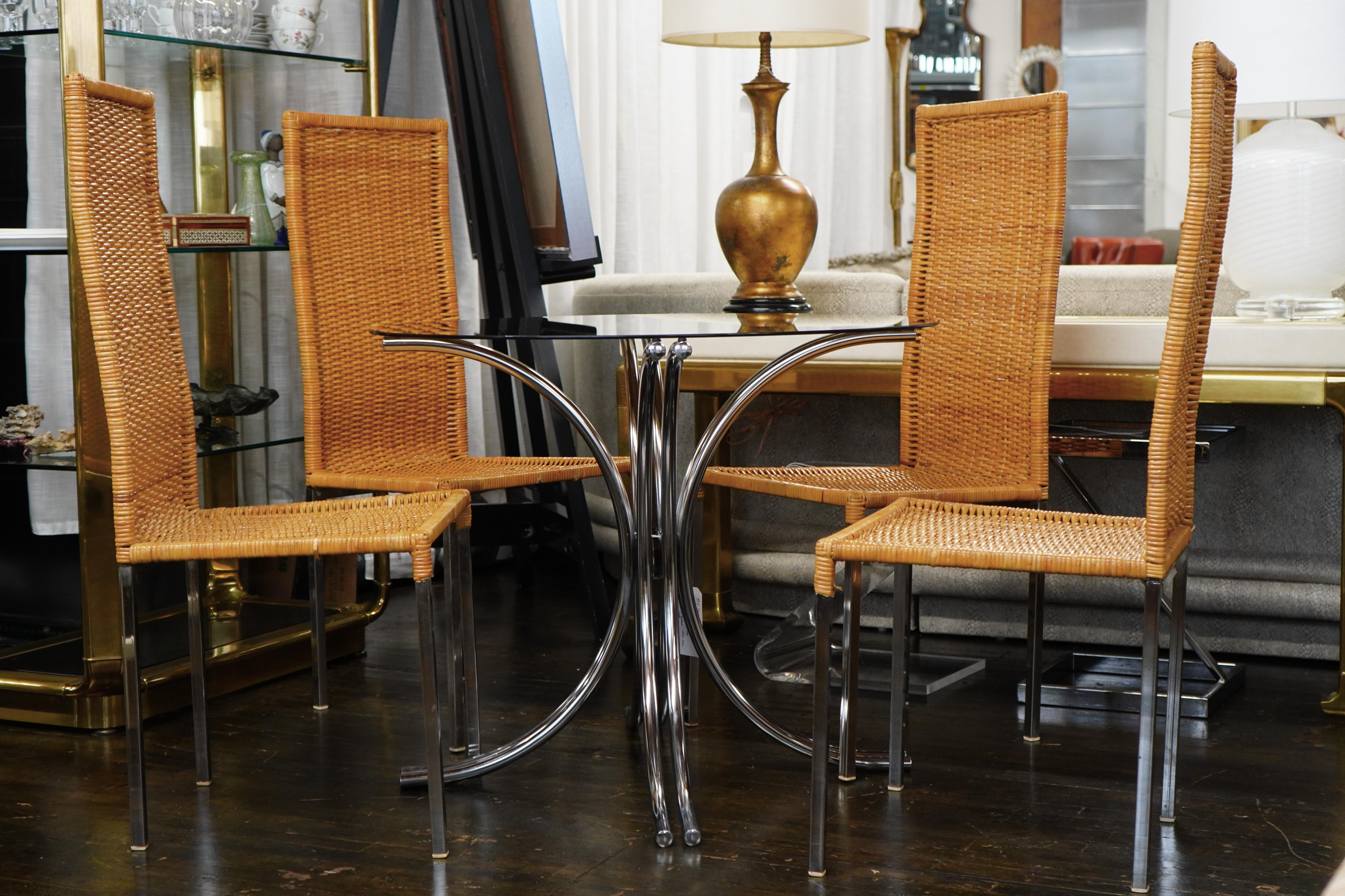 A mid-century modern bistro table with a chrome base and smoke glass top (that is 36