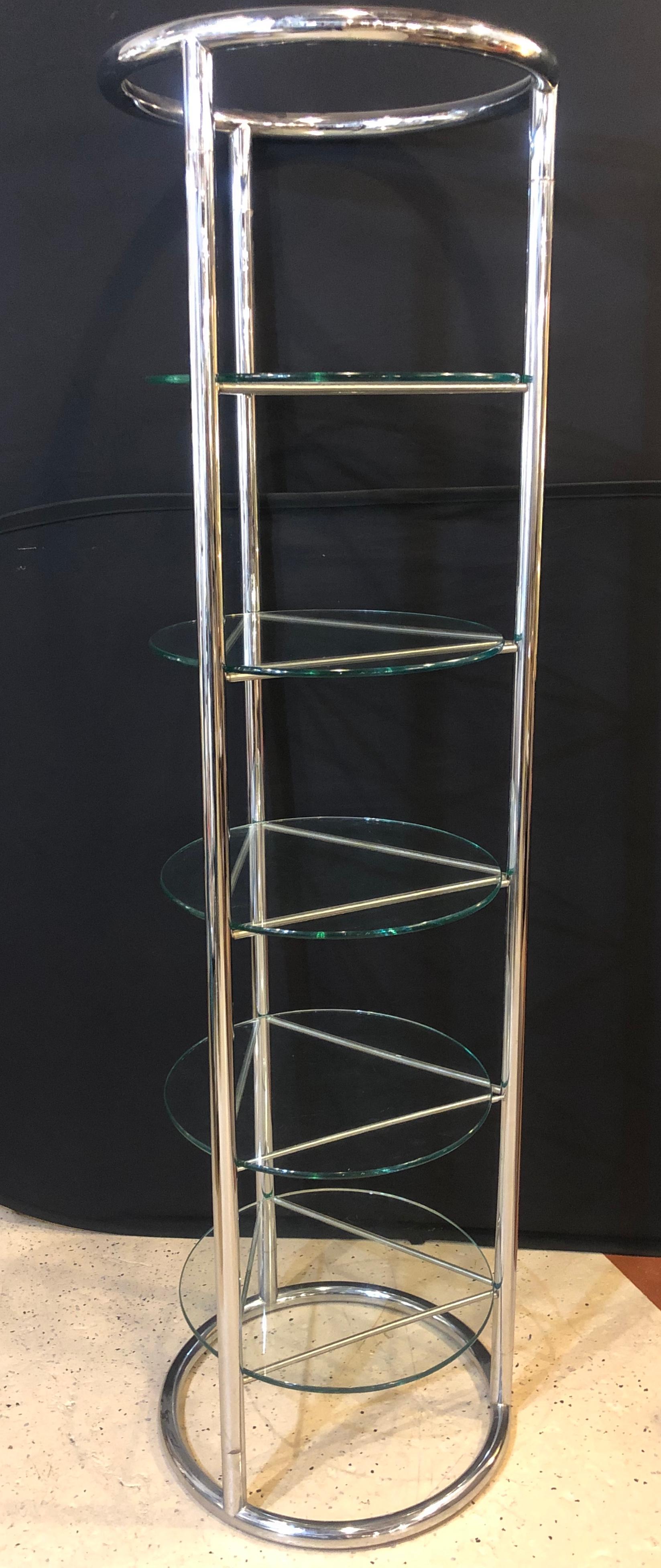Chrome and glass modern tubular five tier étagère / shelf. A fine strong and stable shelving unit in the Hollywood Regency manner.