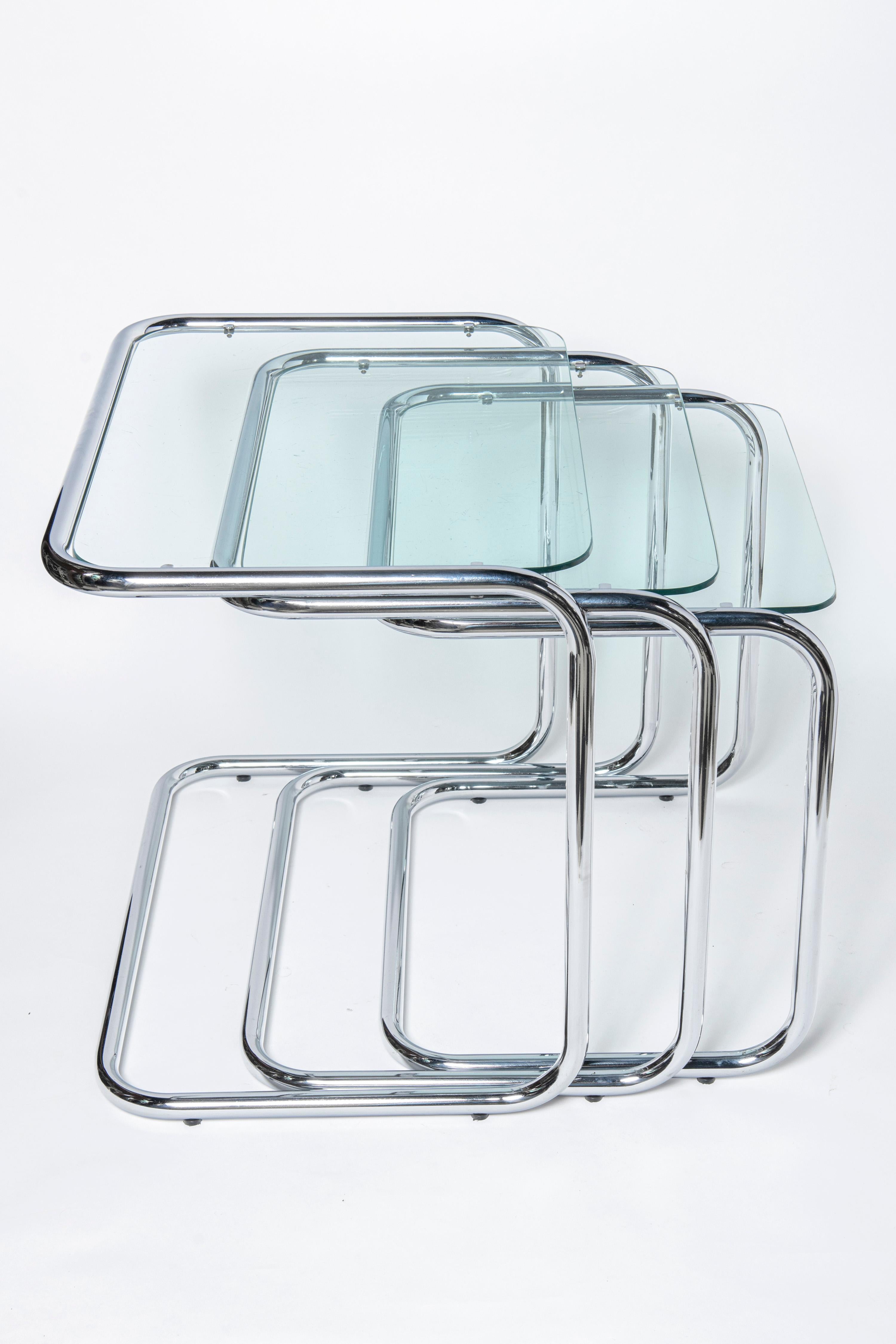 Mid-Century Modern Chrome and glass nest tables Designed by Reinaldo Leiro and Arnoldo Gaite, 1970. For Sale