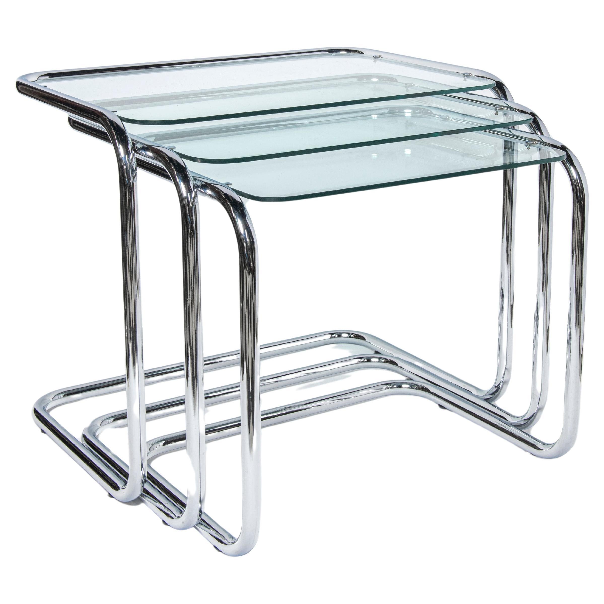 Chrome and glass nest tables Designed by Reinaldo Leiro and Arnoldo Gaite, 1970. For Sale