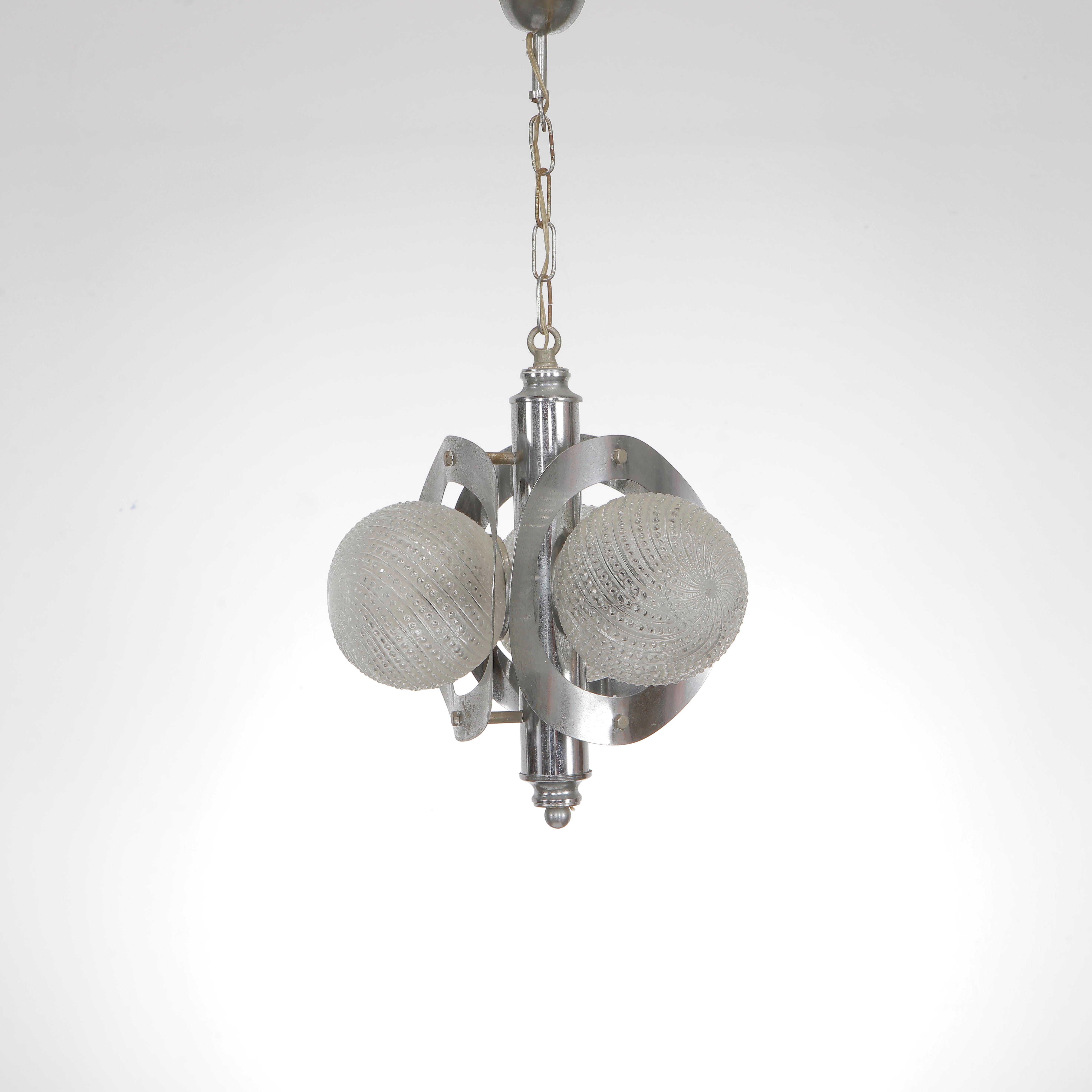 Sleek pendant light featuring chrome structure and layered glass elements, attributed to Veca. A true statement piece from 1970s Italy. Height: 23 in. Diameter: 10 in.