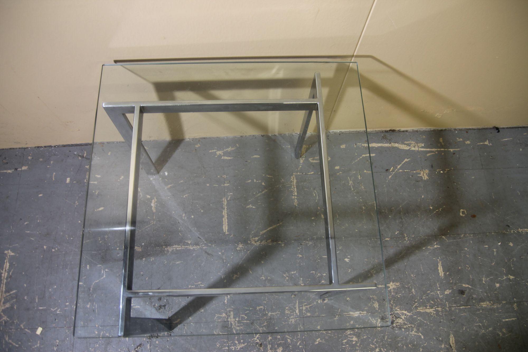 Nice chrome and glass coffee table that can be used as a small coffee table or side table. This table is in the manner of Milo Baughman and is in nice vintage condition. I have a larger version also for sale so the two pieces would work great