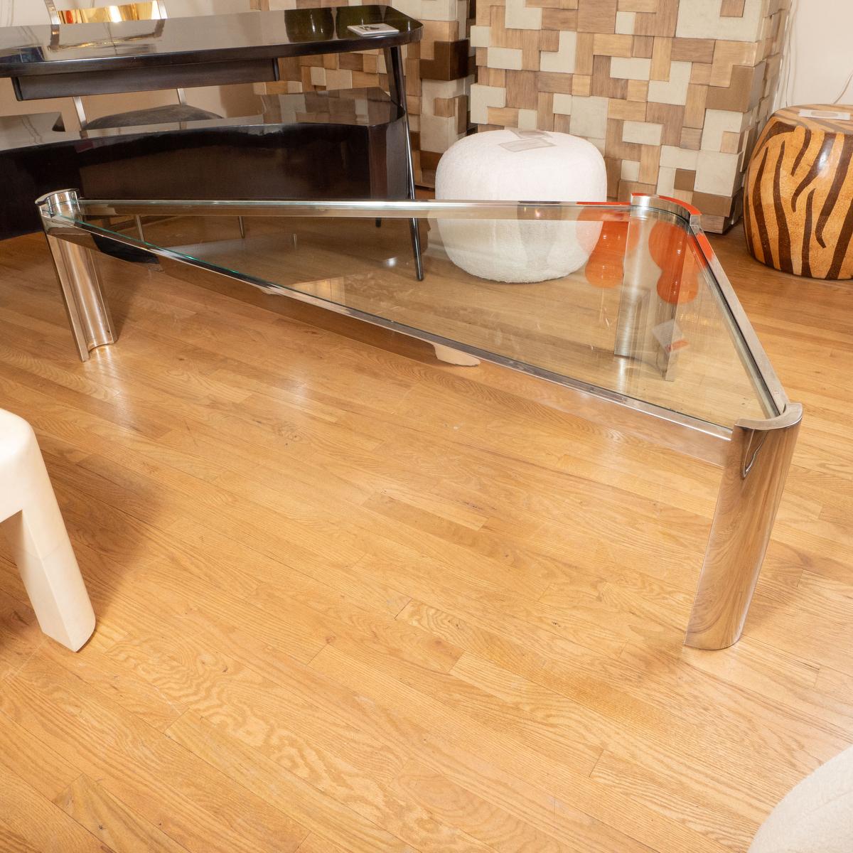 Chrome and glass triangular coffee table by Ron Seff.