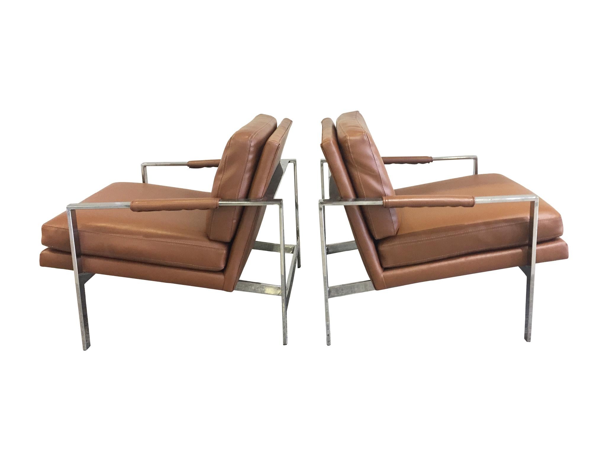 An exceptional pair of lounge chairs attributed to Milo Baughman, whose furniture are renowned for their simple, clean lines. Manufactured in the 1960s. These lounge chairs consist of a sturdy chrome frame with sleek lines & a warm caramel leather