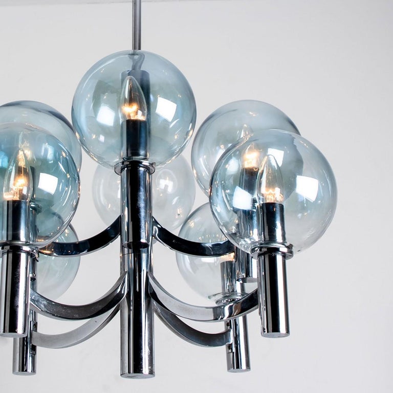 Chrome and Light Blue Glass Chandelier in the style of Arne Jakobsson