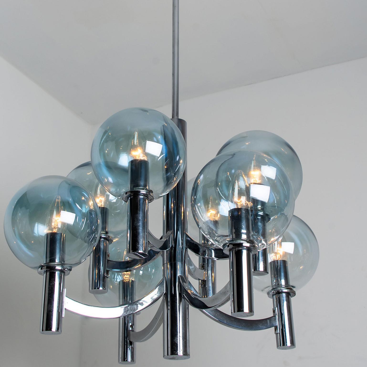 Late 20th Century Chrome and Light Blue Glass Chandelier in the style of Arne Jakobsson, 1970s For Sale