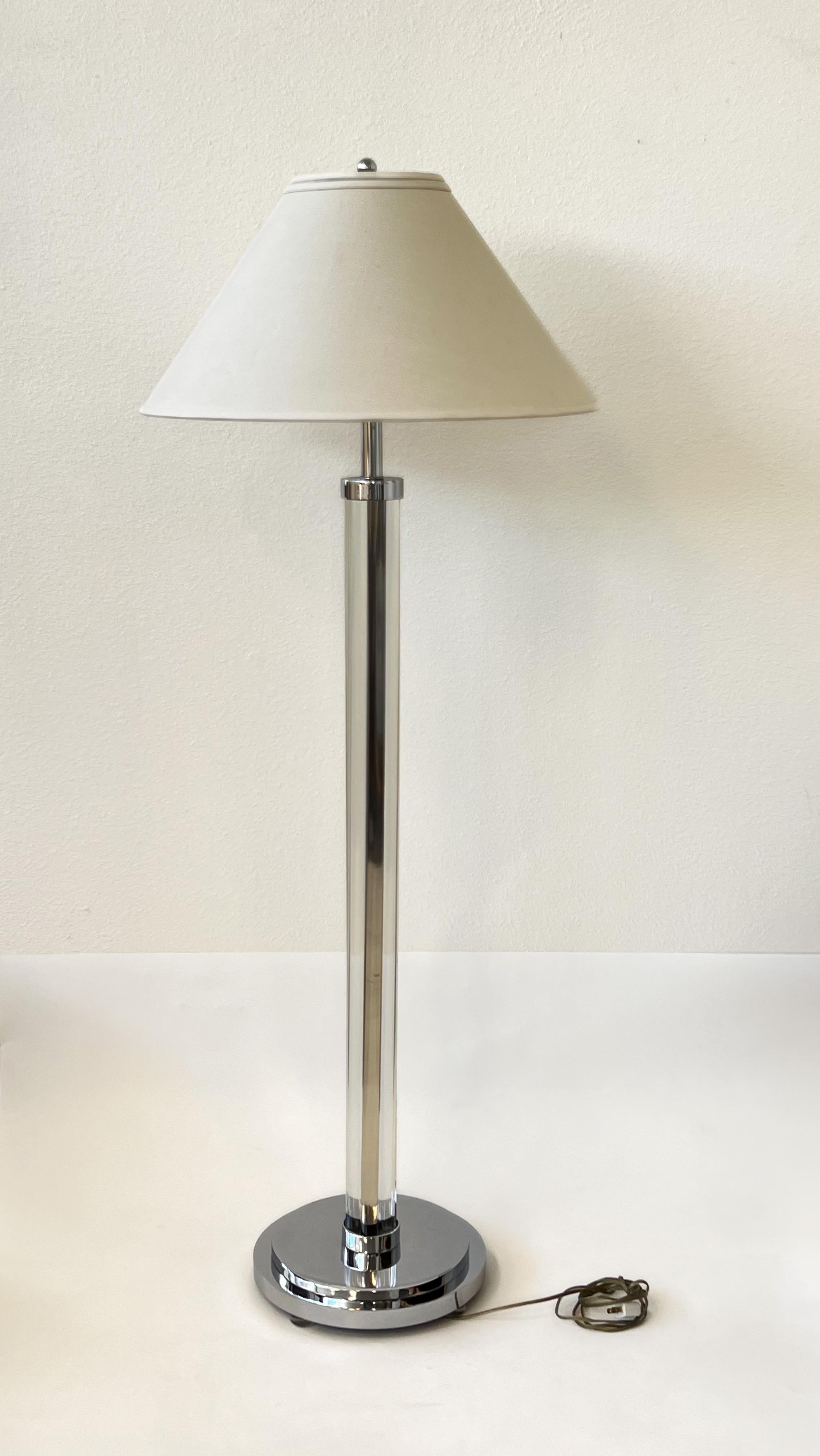 1970’s Polish chrome and clear lucite by renowned American designer Charles Hollis Jones. 

In original vintage condition, shows minor wear consistent with age. 
Wired for US, it takes two 75w Max bulbs. 

Measurements: 13” Diameter, 59.25” High.