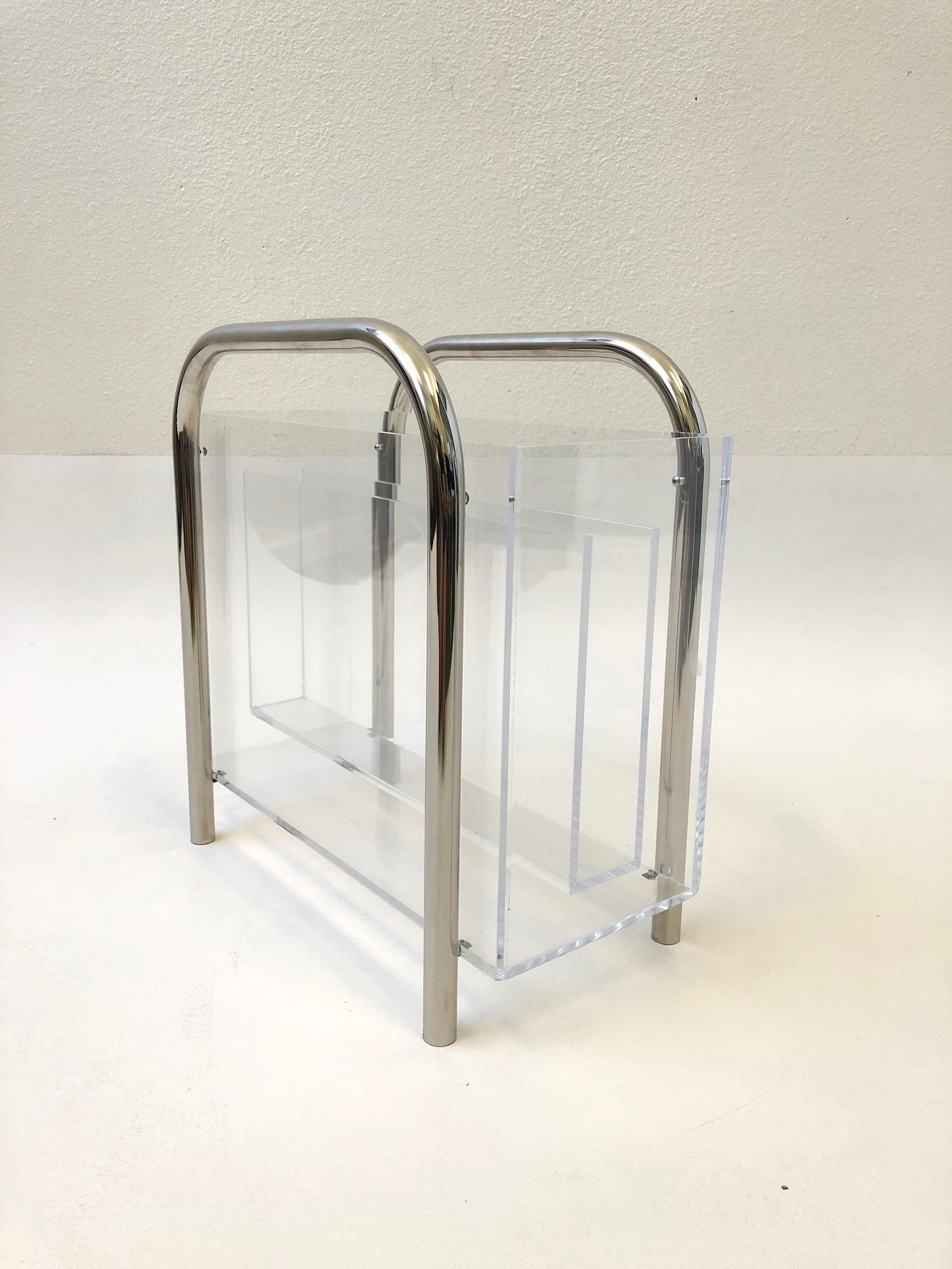 A glamorous polish chrome and clear Lucite magazine holder design by “Mr Lucite” Charles Hollis Jones in the 1970s. The Lucite shows minor wear consistent with age. Book not included.
Dimensions: 8” deep 15.5” wide 15.5” high.