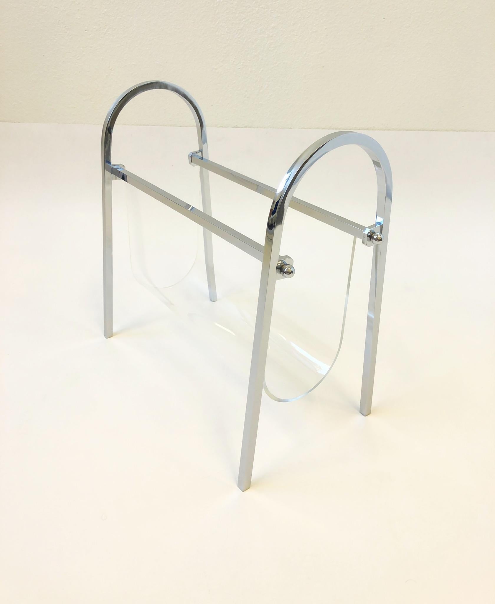 A beautiful 1970s polish chrome and clear Lucite “Arch Line” magazine holder by Charles Hollis Jones. The magazine holder shows minor wear on the Lucite. 

Dimensions: 14.5” high 19” wide 10” deep.