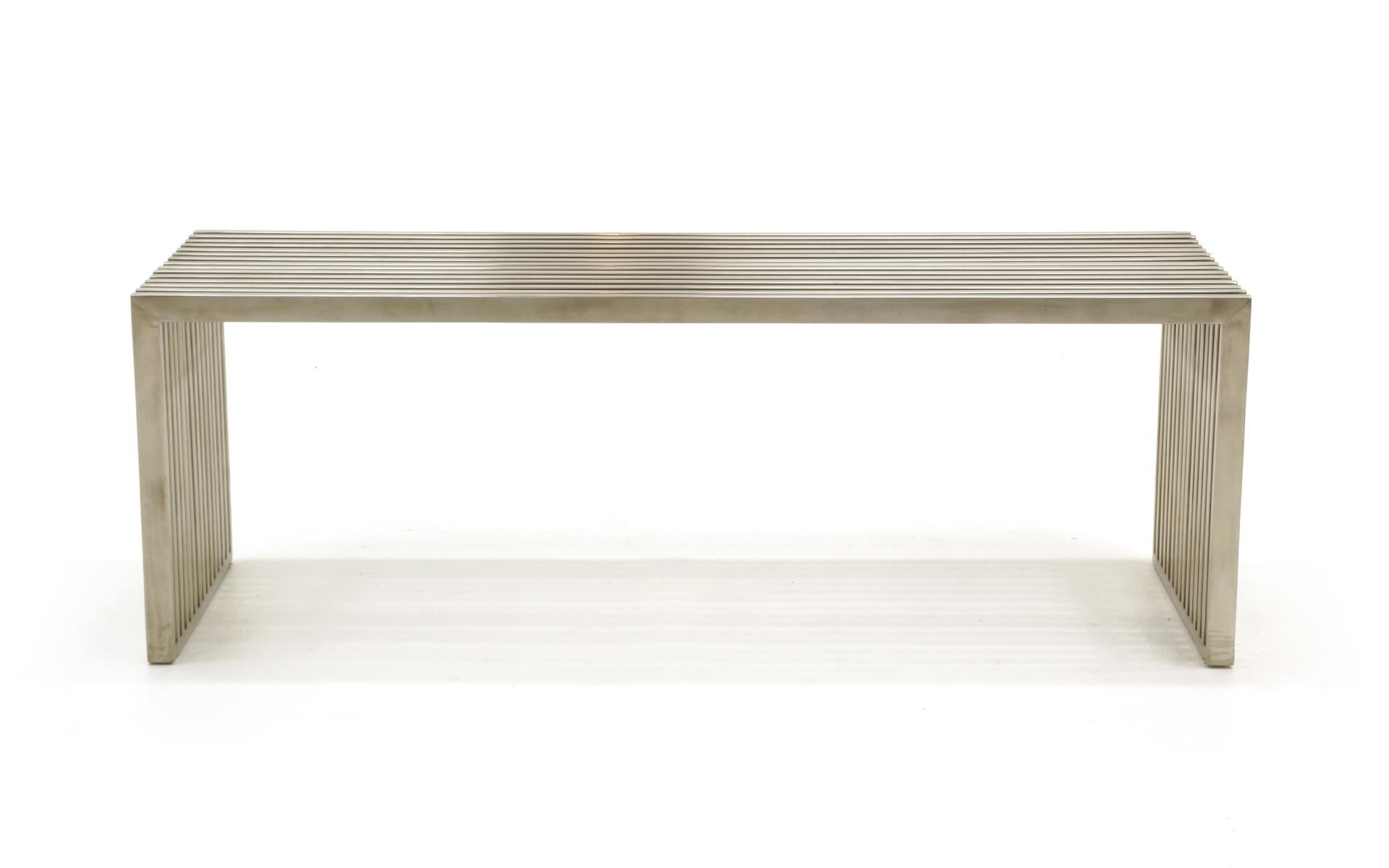 1970s chrome slat bench with Lucite / acrylic spacers between the slats often attributed to Milo Baughman. Super sturdy construction and in very good condition. Ready to use.