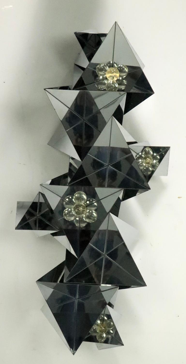 Stunning folded chrome triangle forms with Lucite balls as decorative elements, wall hanging sculpture, attributed to Curtis Jere. The sculpture can be hung vertically or horizontally, it is in very clean, original condition, ready to install.