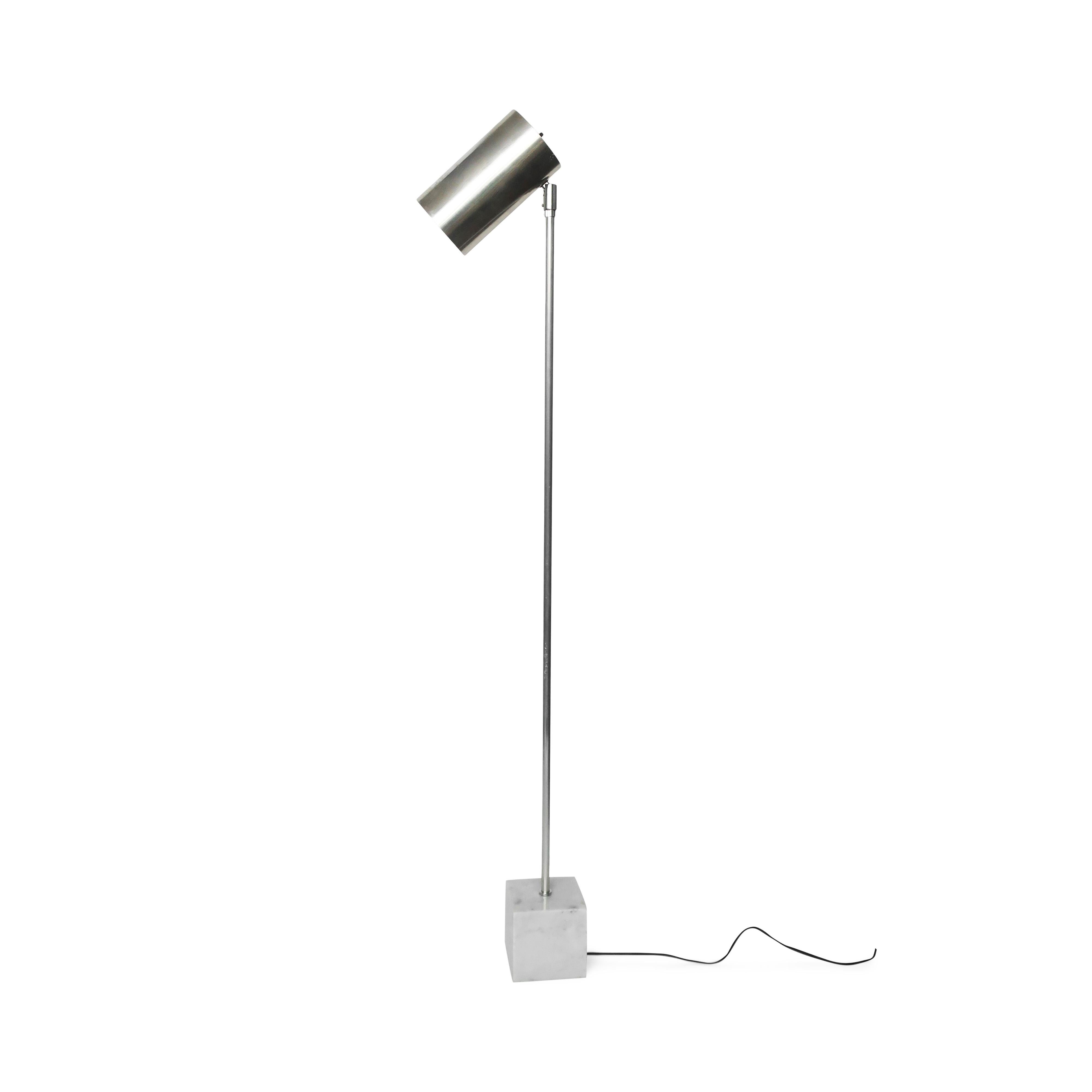A classic floor lamp design by Robert Sonneman for Kovacs: a pivoting can-shaped chrome shade sitting atop a thin chrome stem and square marble base.

In vintage condition with wear consistent with age and use, including scratches and minor scuffs