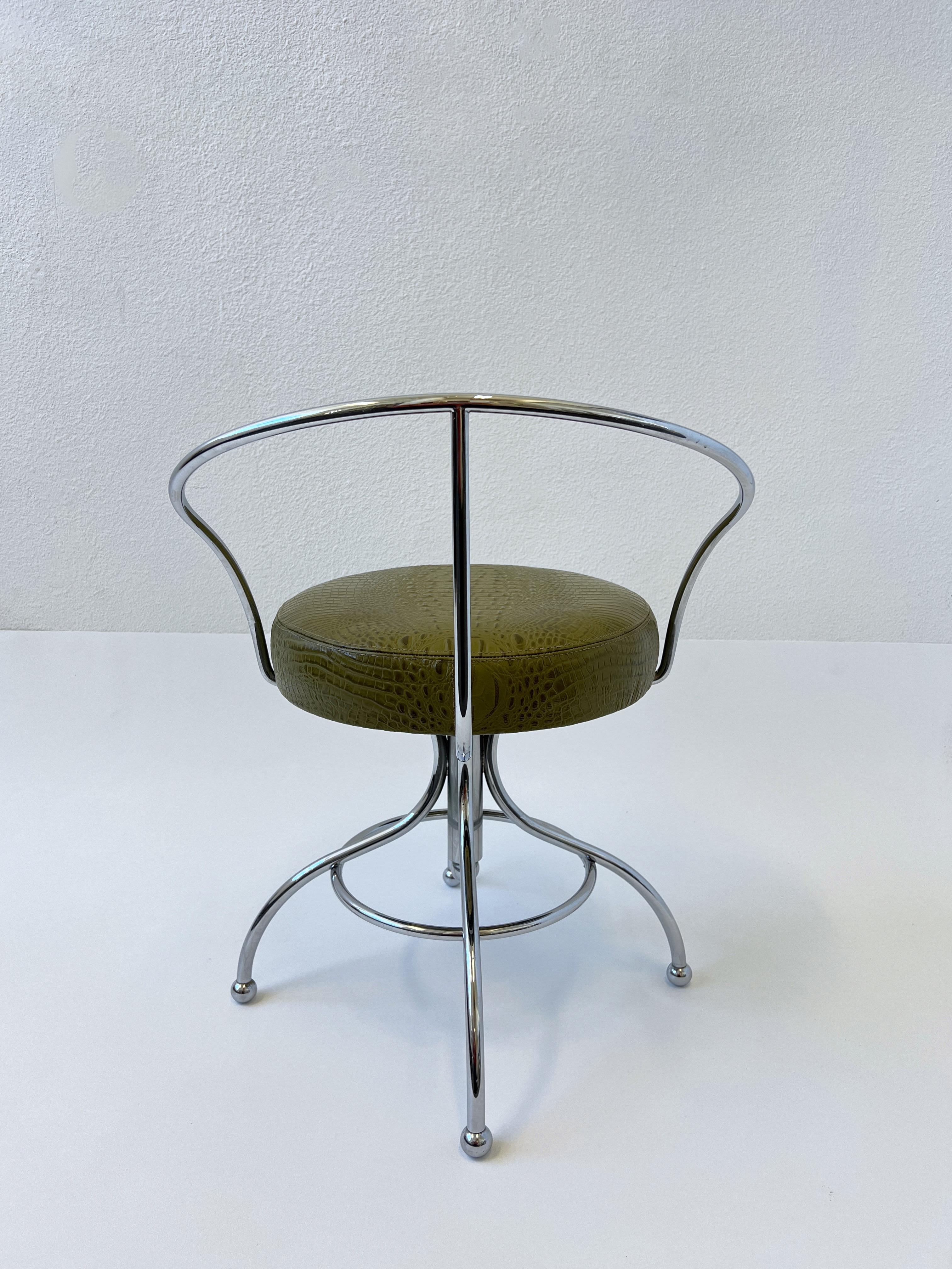 Glamorous 1970’s swivel polish chrome vanity stool, part of the “Ball Line” by American renowned designer Charles Hollis Jones. 
Out of an Arthur Elrod Design estate in Palm Springs. 
The frame is in beautiful original condition, the seat was
