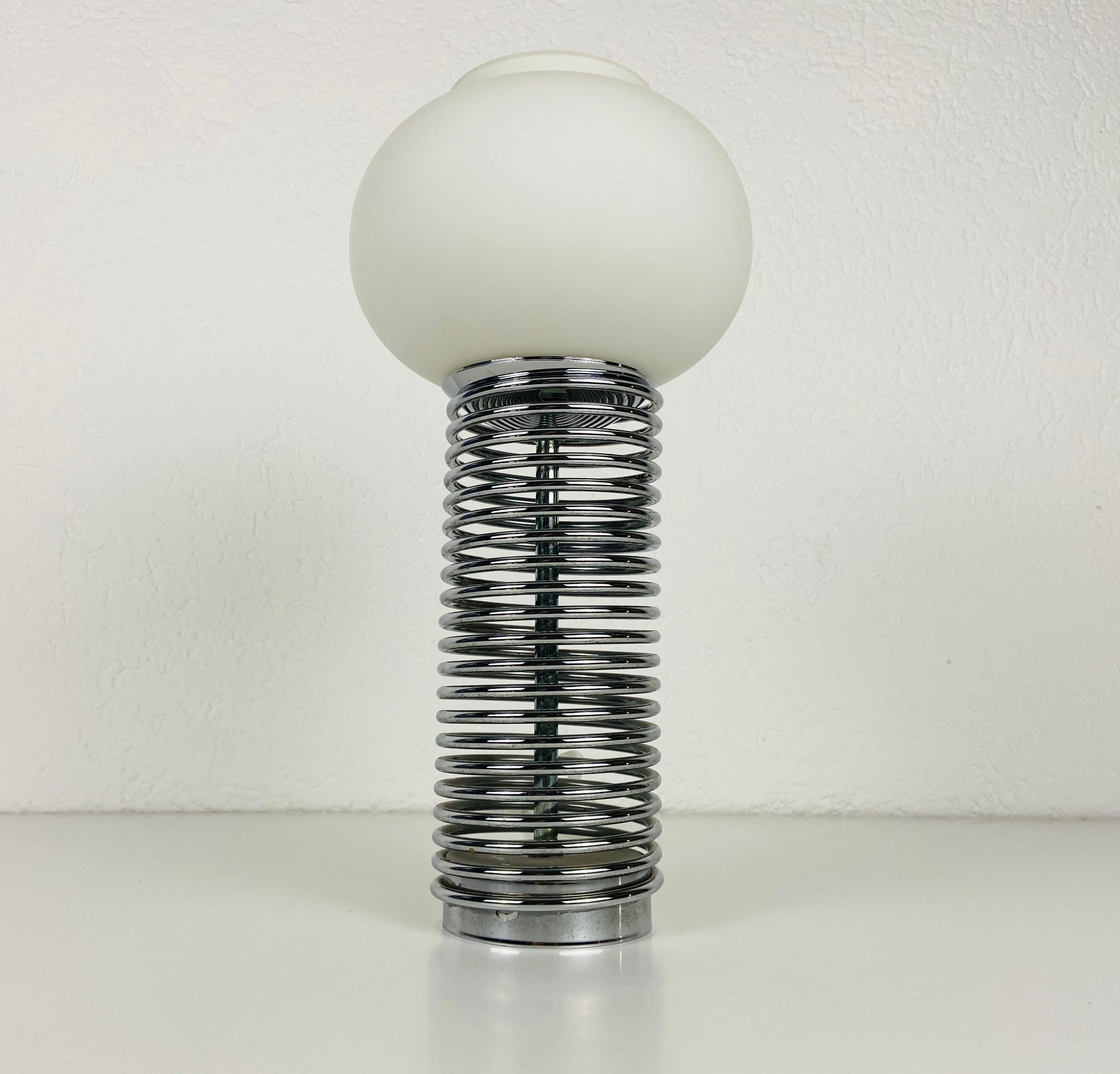 Extraordinary table lamp made in Italy in the 1960s. It is fascinating with its opal glass stuck on the chrome body.

Measurements:

Height 34 cm

Diameter 17 cm

The light requires one E27 (US E26) light bulb. Works with both 120/220V. Very