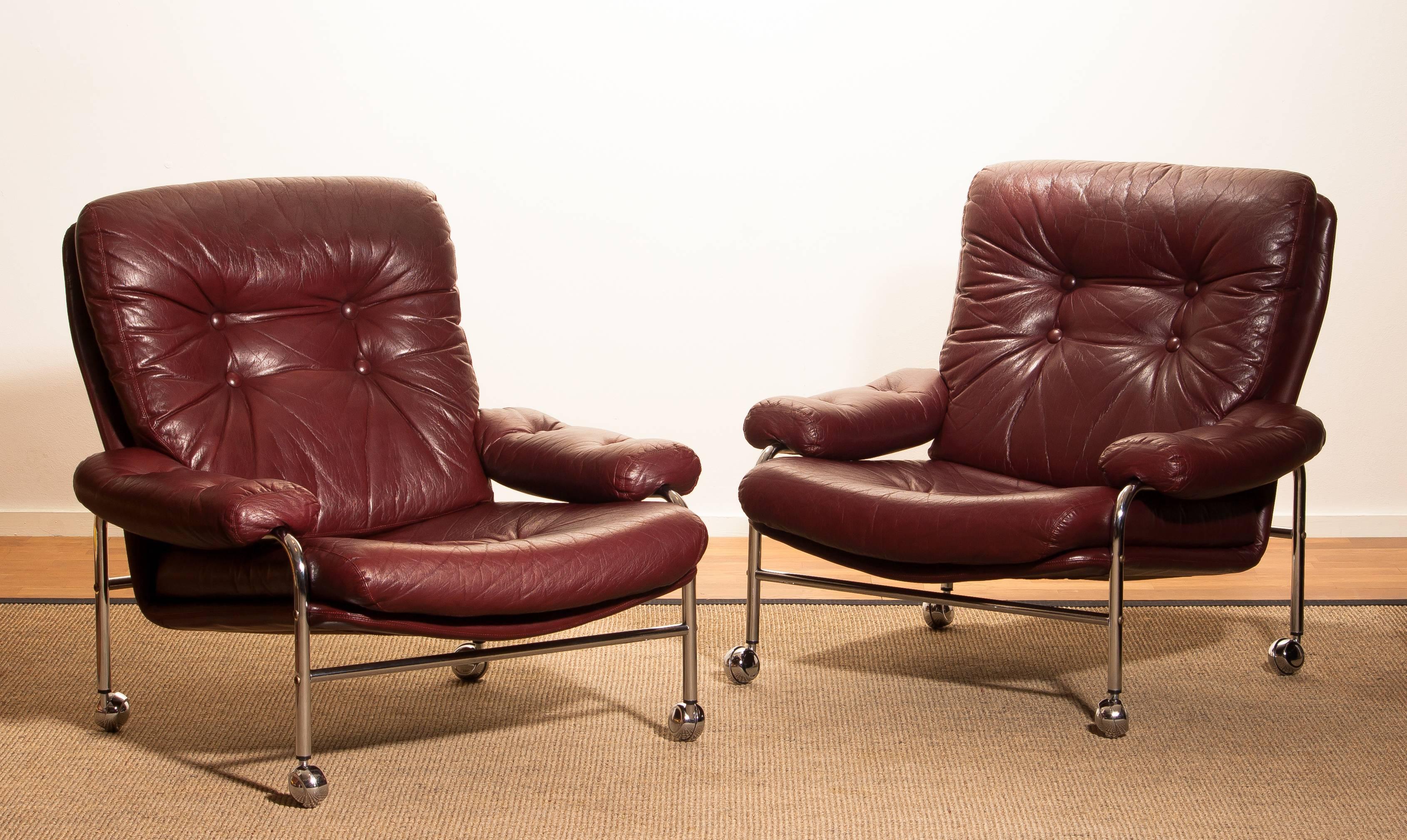 Beautiful set of two extremely comfortable easy or lounge chairs made by Scapa Rydaholm, Sweden.
These, typical Scandinavian chairs are upholstered with oxen red leather based on a chromed metal frame.
All in perfect condition.

Period 1970s
