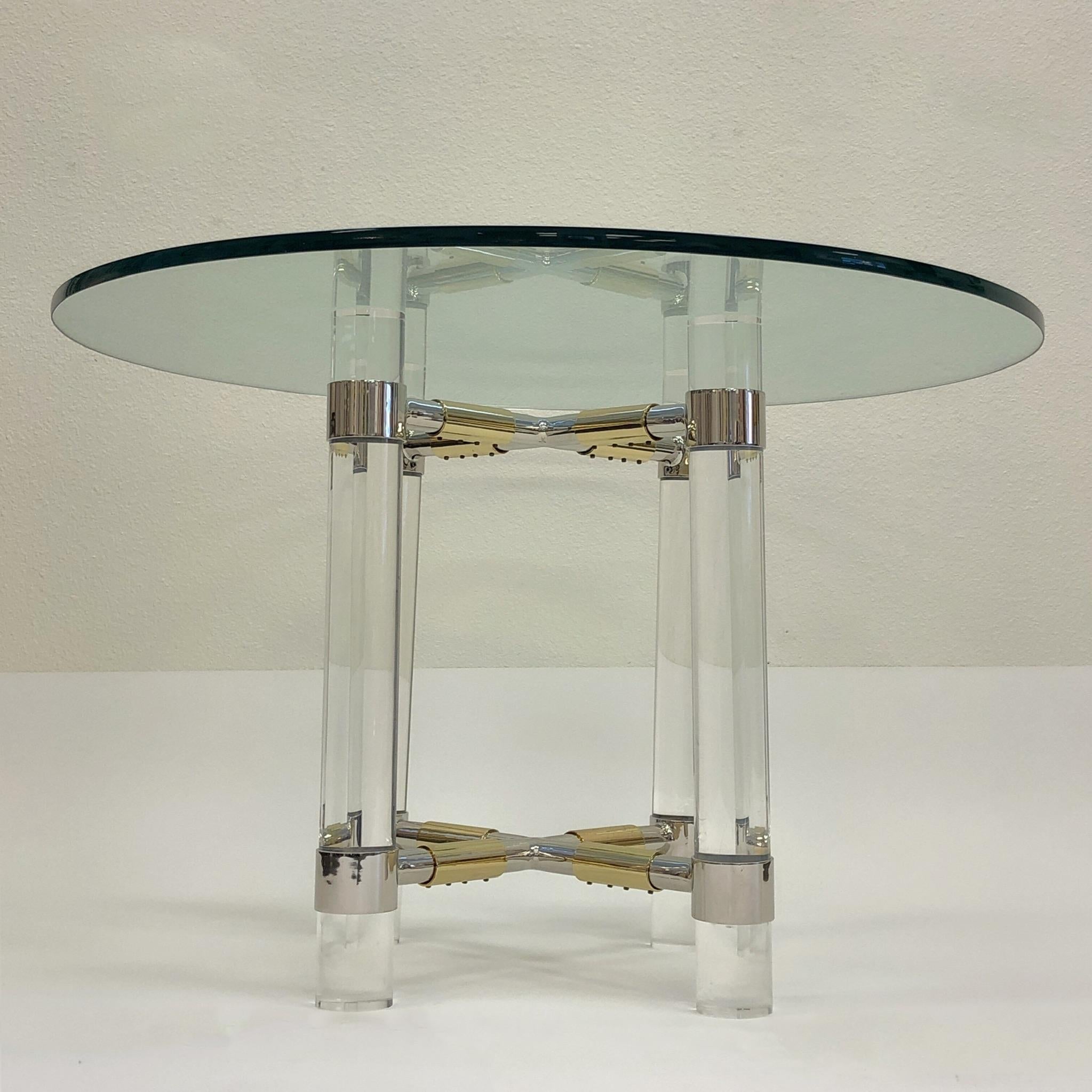 A rare polish chrome, brass and clear Lucite game table from “Post Line” by renowned American designer Charles Hollis Jones. All the metal has been newly re-plated and the Lucite has been newly professionally polished. The Lucite does have some