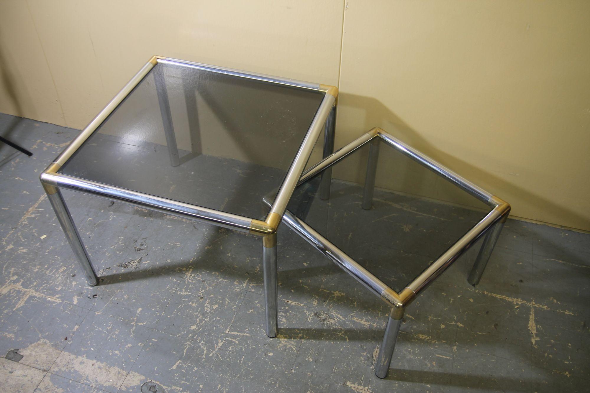 Nice set of chrome tables attributed to Milo Baughman. This simple design using chrome and smoke glass will look great in your mid century style home.
Large table is 27 x 27 x 20
Small table is 21 x 21 x 15