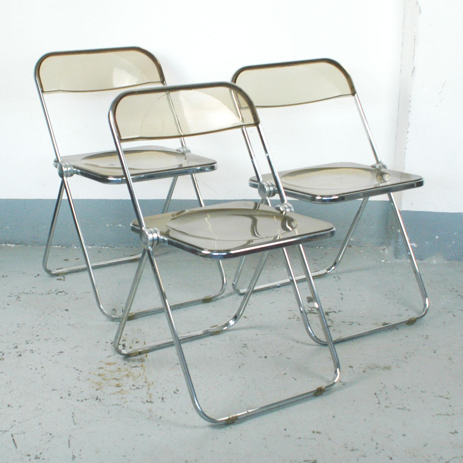 Set of three iconic folding chairs in smoked Lucite and chrome, also available as single.
Very nice condition with only a few signs of wear. Price is for one Chair!
    