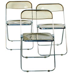 Retro Chrome and Smoked Grey Lucite Plia Folding Chairs by G. Piretti for Castelli