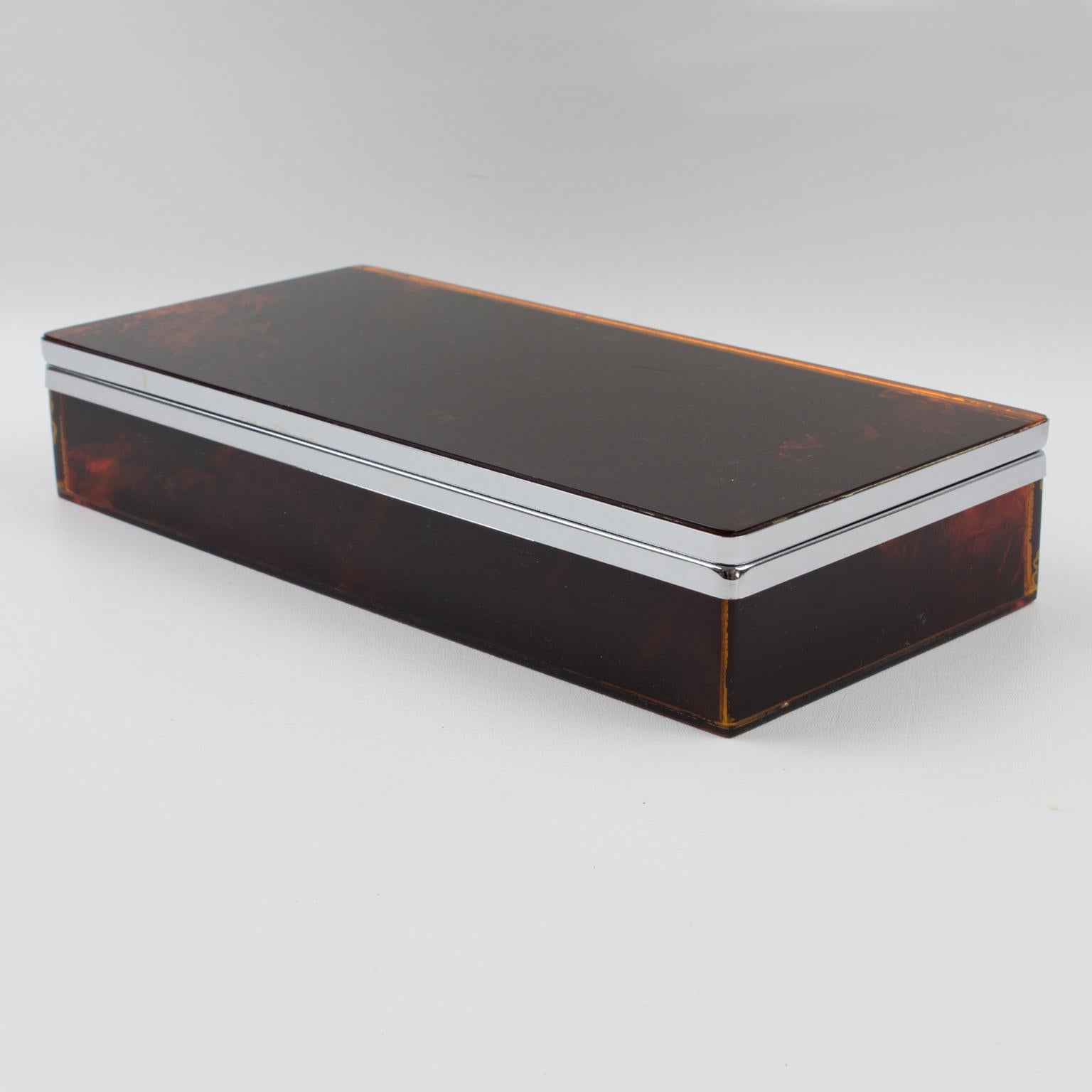 This elegant 1970s decorative lidded box is perfect for living space or vanity decoration. The chrome-plated framing is complimented with Lucite elements in a tortoiseshell (tortoise) textured pattern. The quality is impressive, especially with this