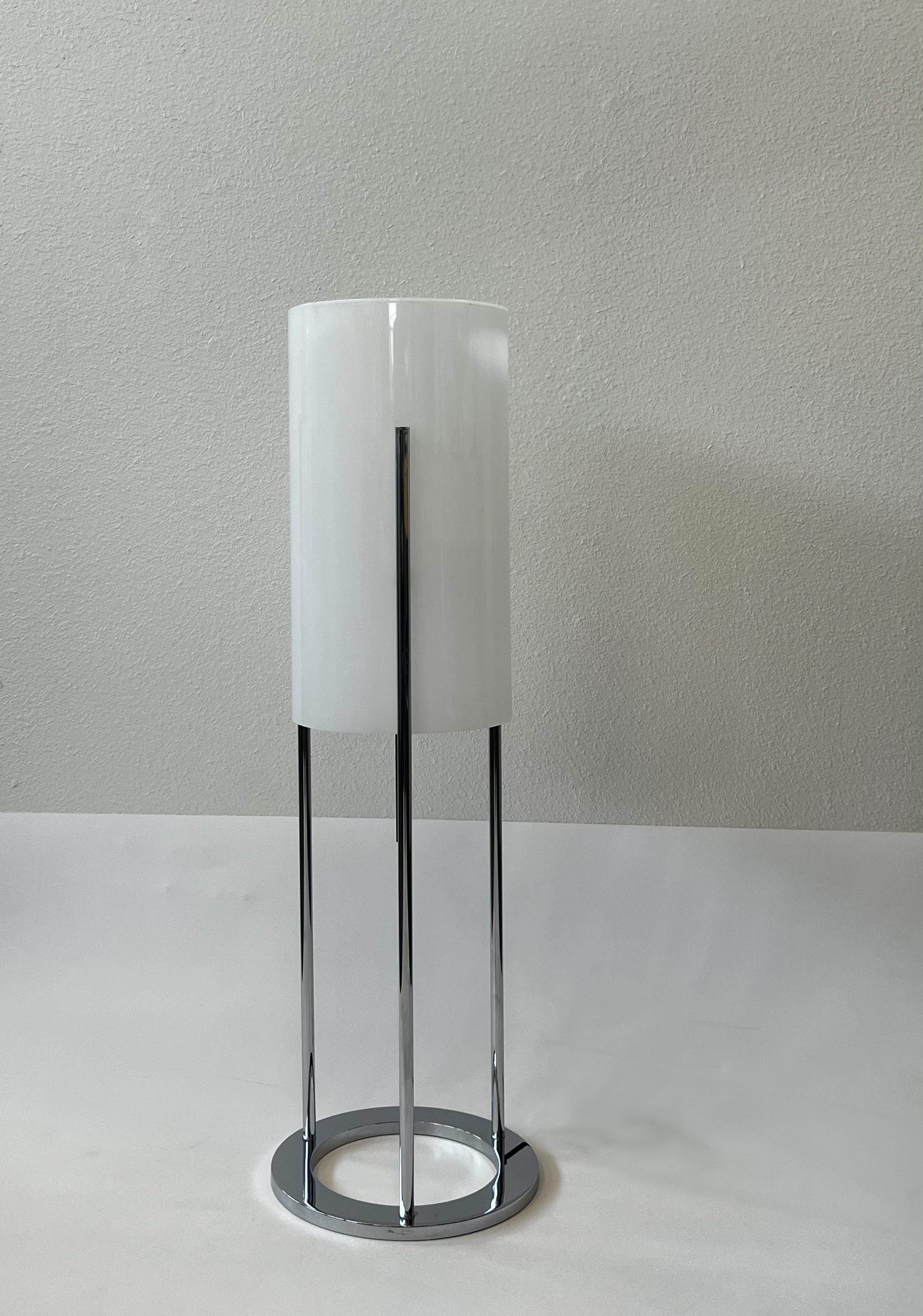 Beautiful 1970’s polish chrome and white acrylic table lamp by English designer Paul Mayen.
In good original vintage condition with minor wear consistent with age. 
It has a small stress crack that’s hardly noticeable, where the screw is at. 

Wired