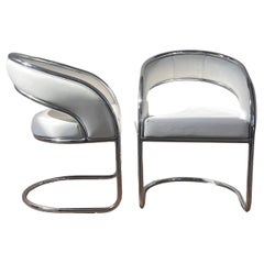 Chrome and white leather chairs by Contemporary Shells, circa 1970