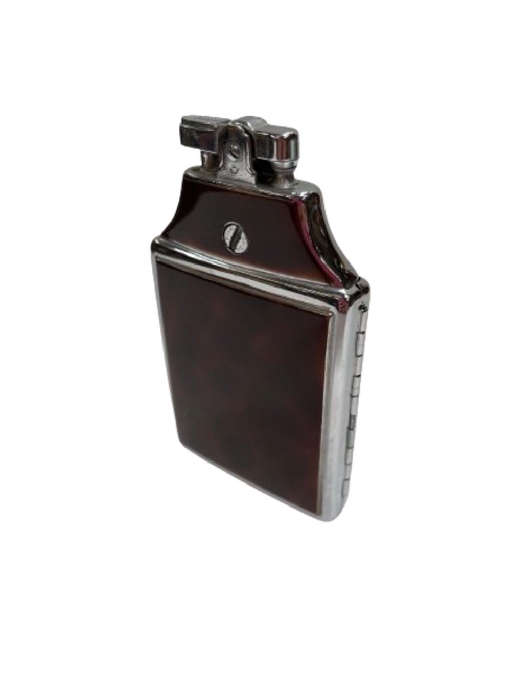 Art Deco enameled tortoiseshell color cigarette case with chrome edges. The case features a flint light along the top with 2 arms inside to hold unfiltered cigarettes.

The lighter comes fully functional with fresh flit and fluid ready for use.