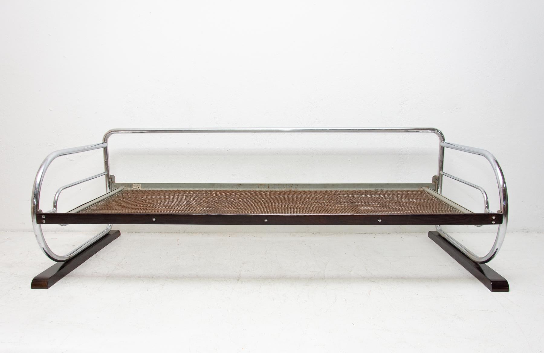 Chromed, tubular steel sofa from the Bauhaus period, 1930s, Bohemia. Made by Robert Slezák company. Chrome is in good vintage condition, bears signs of aging and use, but overall in very good condition. It has two wooden legs in the shape of a ski.