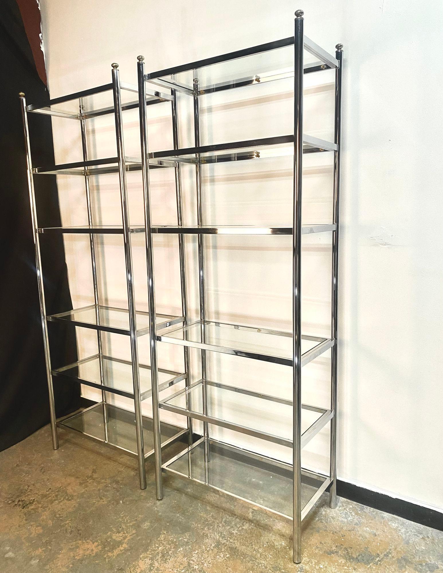 Lovely Chrome & Brass Etagare with six glass shelves. Tubular chrome supports capped off with brass finials. Beautiful and useful furniture for your home or office. Two available.