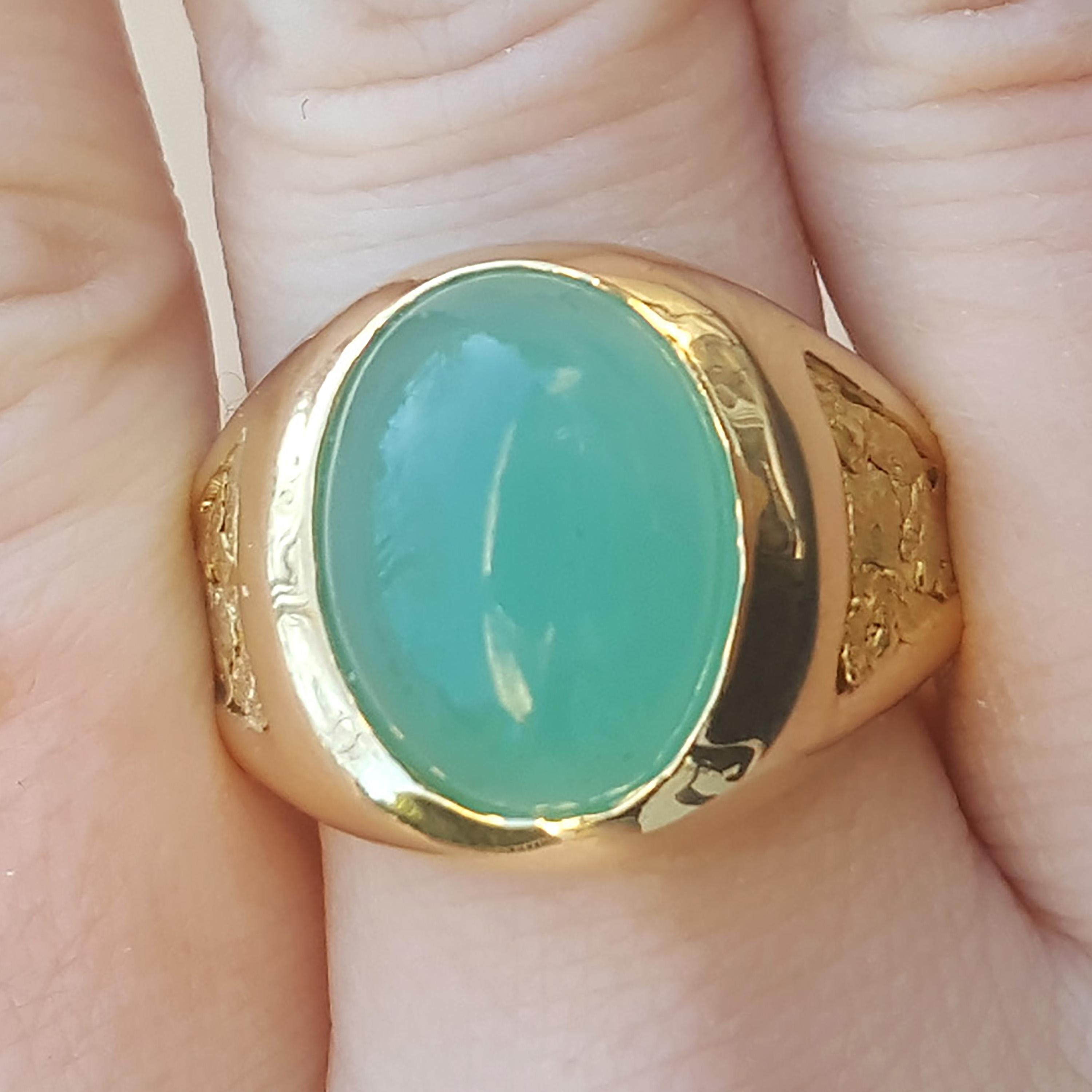 This rare piece of naturally colored chrome chalcedony, found in Zimbabwe in the 1980s, adds a bright and unexpected twist to a classic men’s 18kt ring. The gorgeous natural gold nuggets add rich texture.  This gentleman’s ring is an elegant