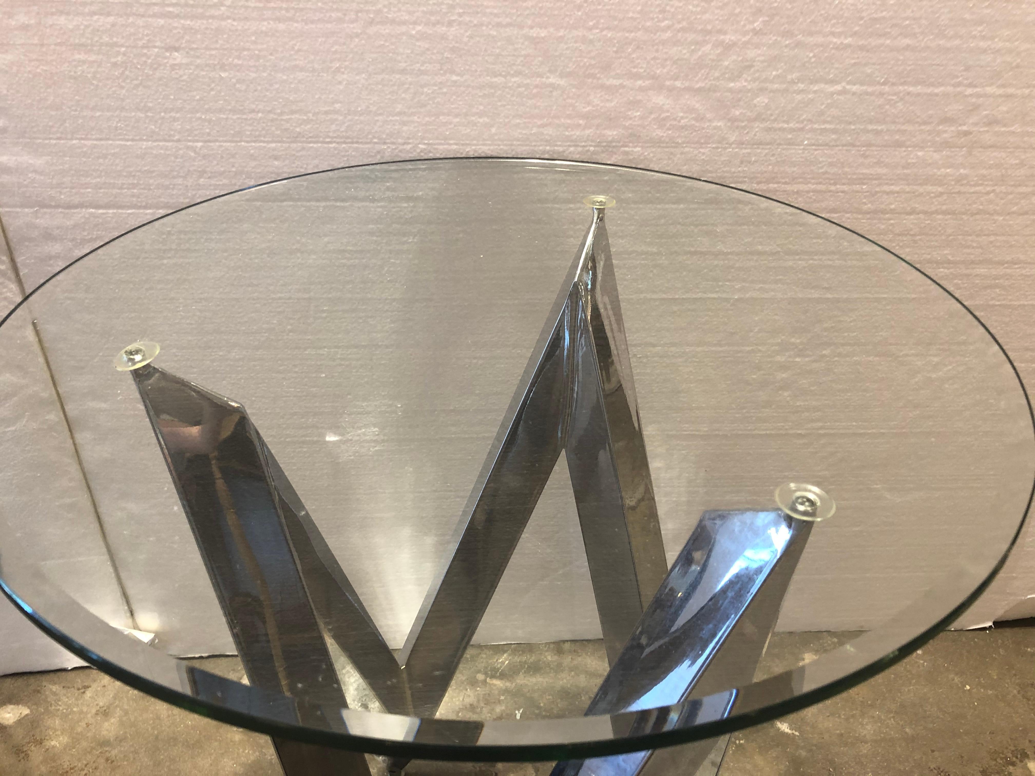 Chrome Chevron design side tables. Angled form. Round glass top.