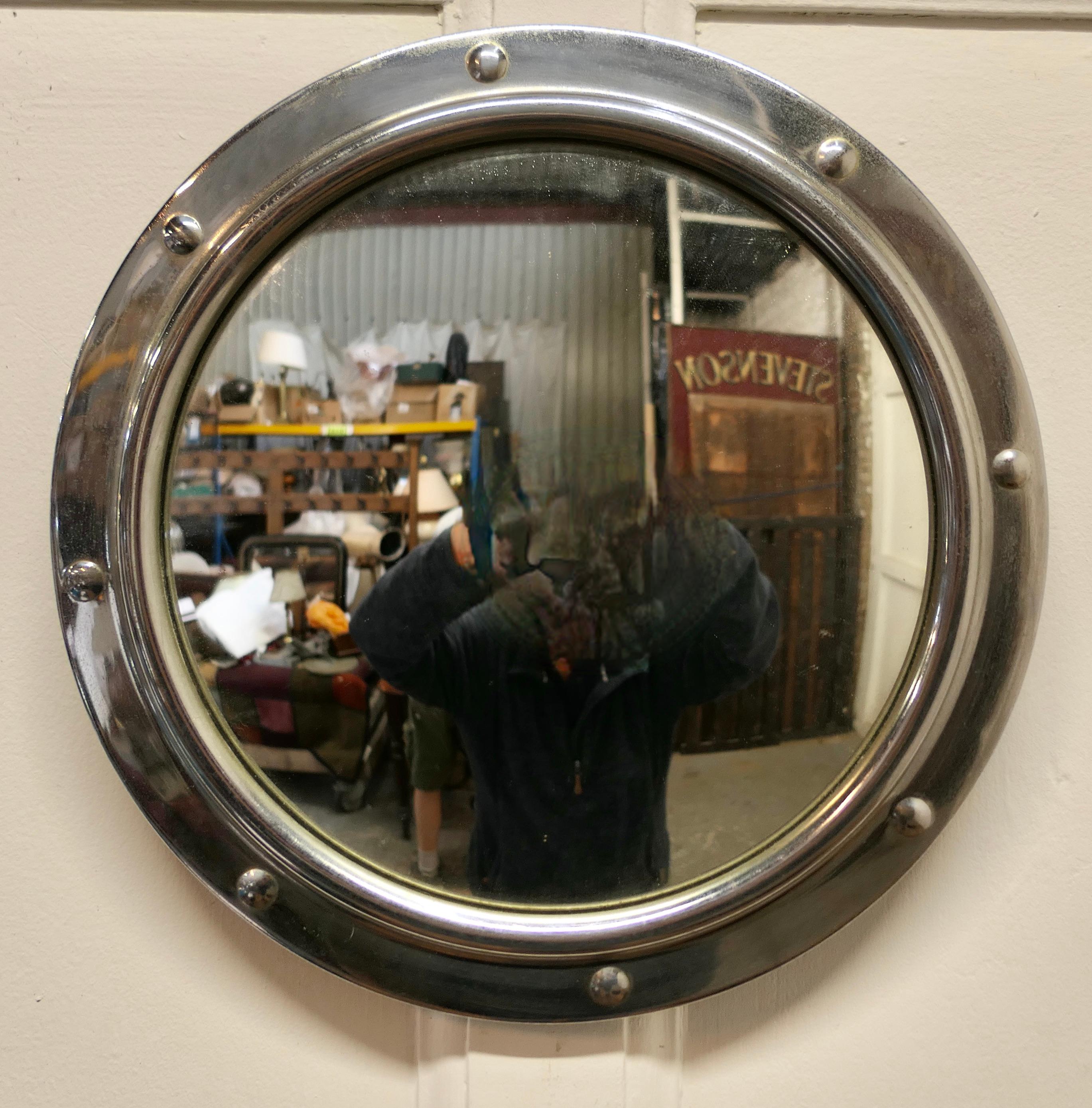Chrome Convex Wall Mirror 

This is an attractive Mirror has a 1.5” wide with simulated rivets giving it a nautical look and has a convex looking glass  
The mirror is in good condition as is the original convex looking glass

The mirror is 12” in
